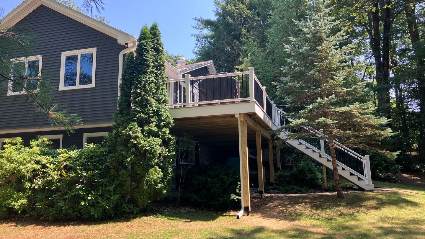 Deck replacement using Trex Transcend Rope Swing and Transcend Railings.Trex Rainescape by DiGiorgi Roofing and Siding Inc