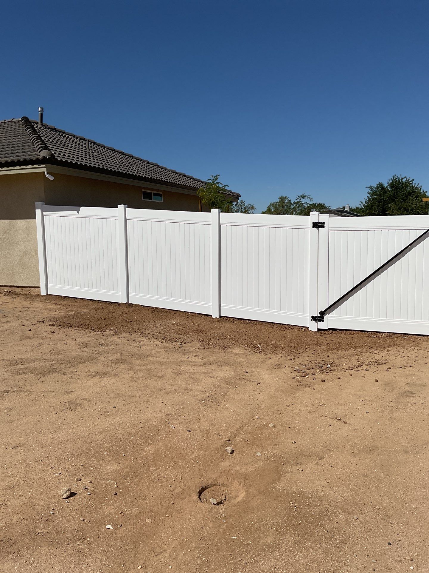 6ft White Privacy Vinyl Fence with Chain-link Fence by Fence Guys Inc.