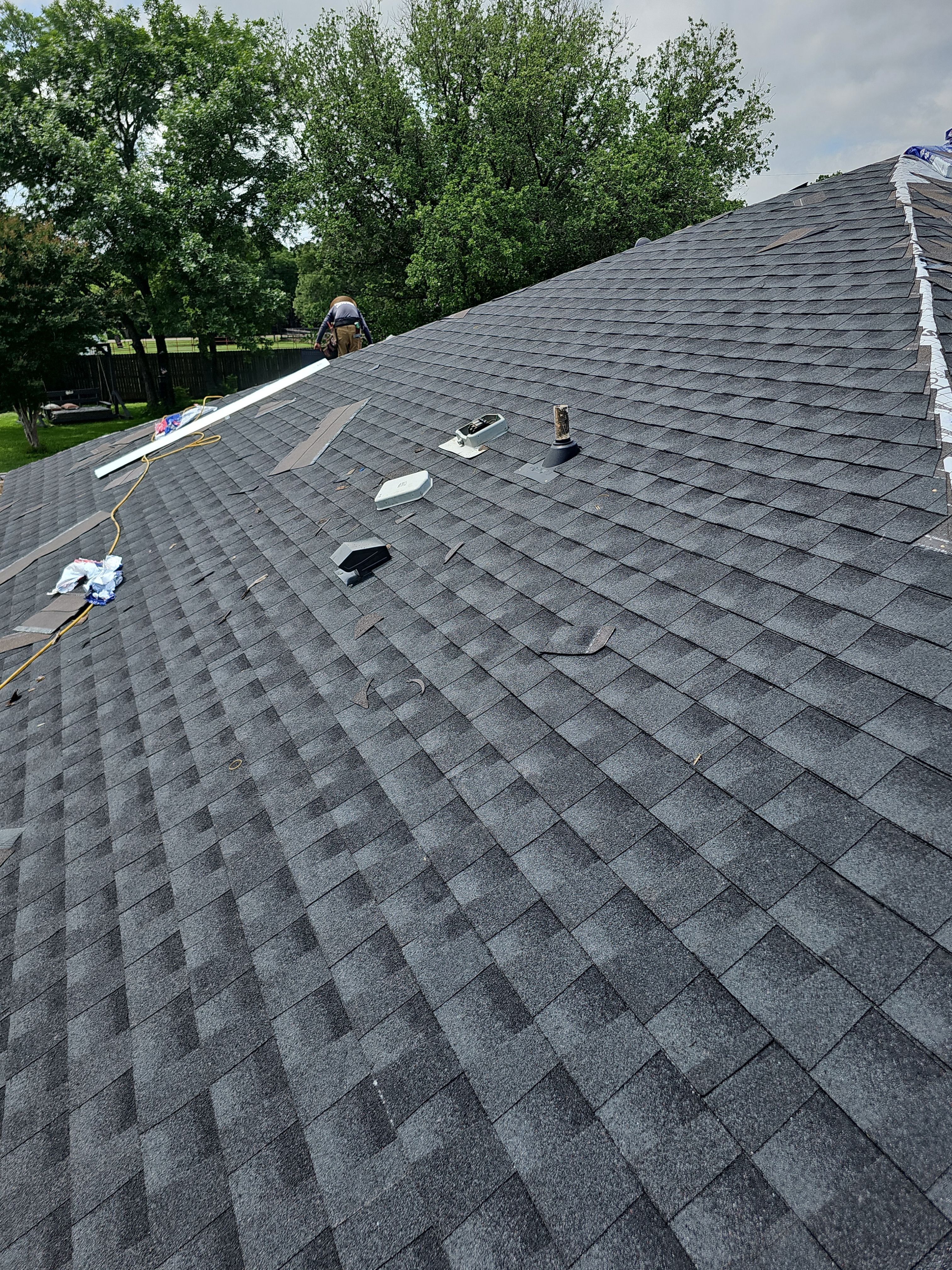 "Full Roof Replacement Due to Hail and Water Damage – Before & After" by road roofing llc