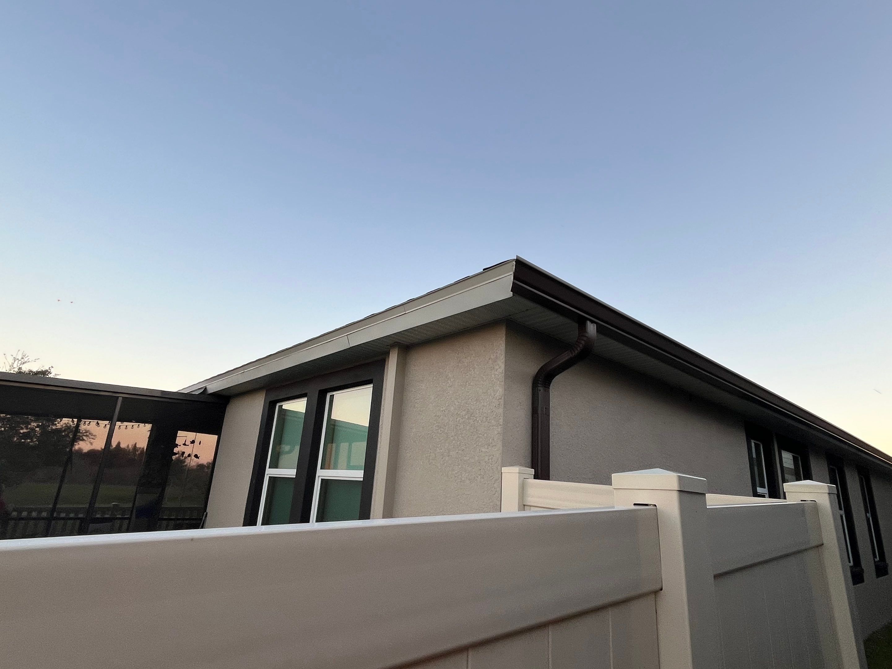 3X4 elbow Downspouts using Musket Brown Seamless Gutters in Lakeland FL by Gutter Professors