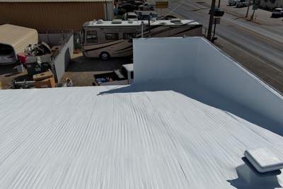 Spray foam and coatings using Conklin Benchmark/ PUMA XL acrylic coatings over metal and foam