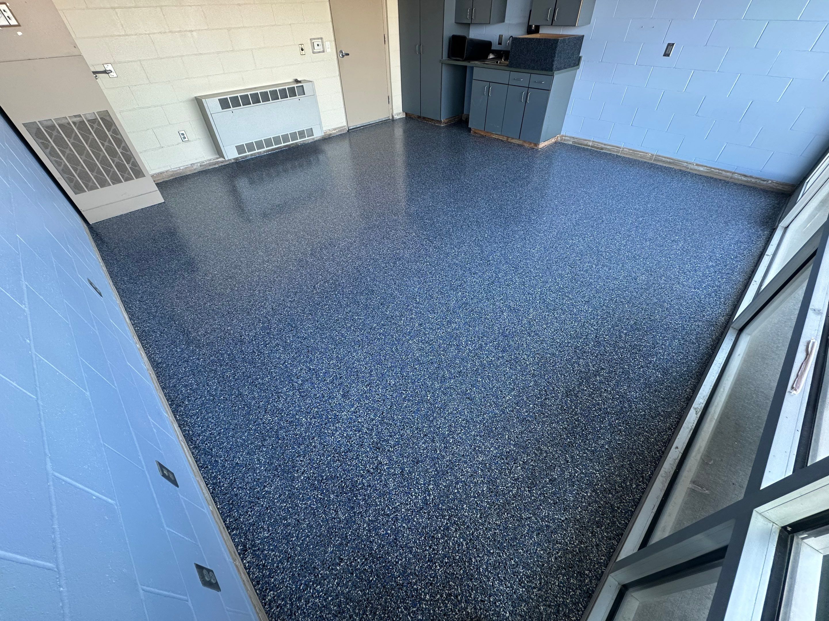 Commercial Epoxy Floor Coating for Stadium Viewing Suites in Sioux Falls by Select Painting, Coatings & Garage Cabinets
