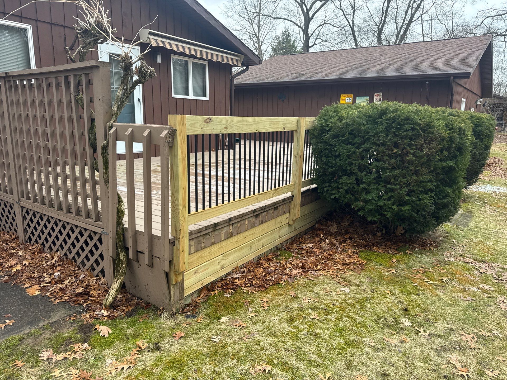 Muskegon Deck Restoration with Pressure Treated Railings and Wood Staining by Gordon Painting