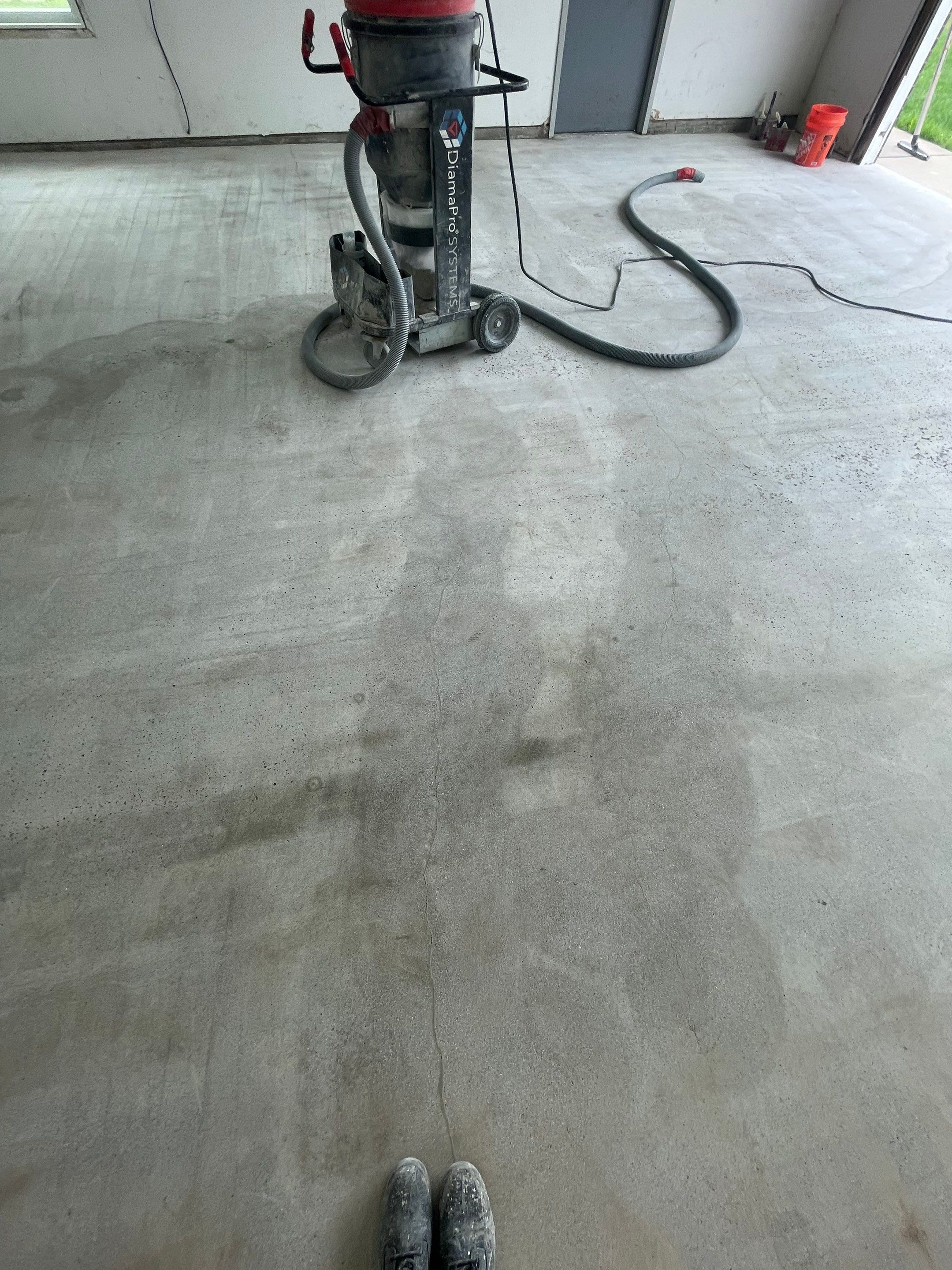 Coyote Flake Concrete Coating for Sioux Falls Garage by Select Painting, Coatings & Garage Cabinets