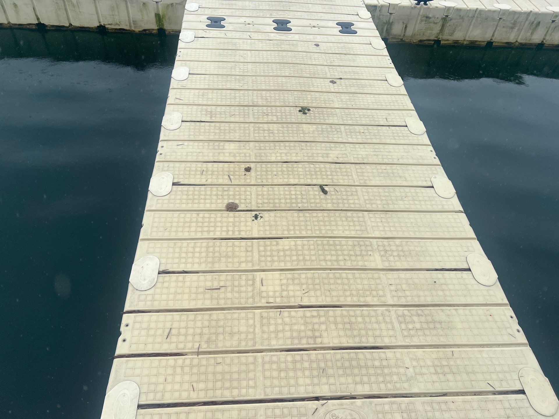 Power washing of floating dock by Northern Power Washing LLC.