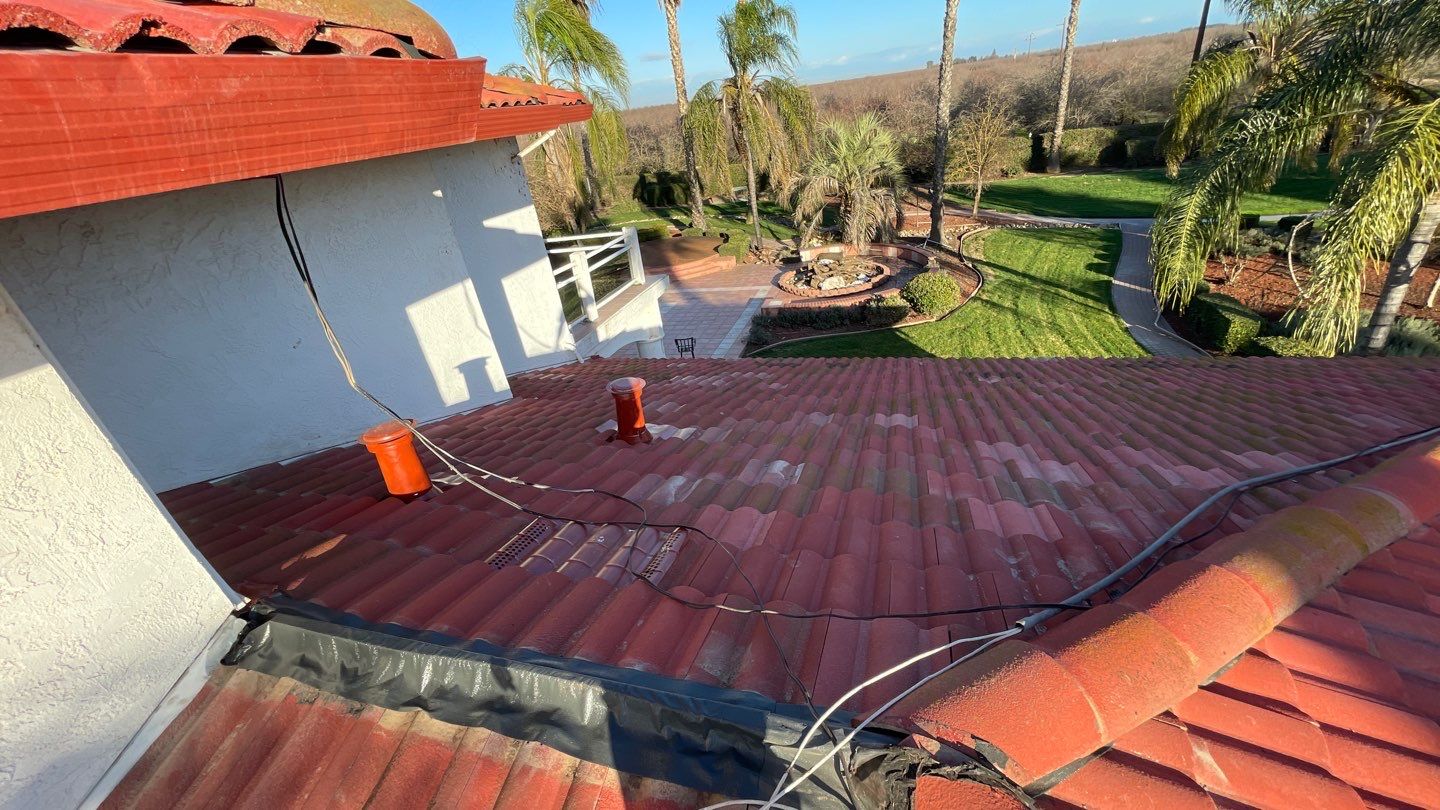 Tile refurbish project using existing tiles and replaced underlayment and battens by Straight Edge Roofing Inc