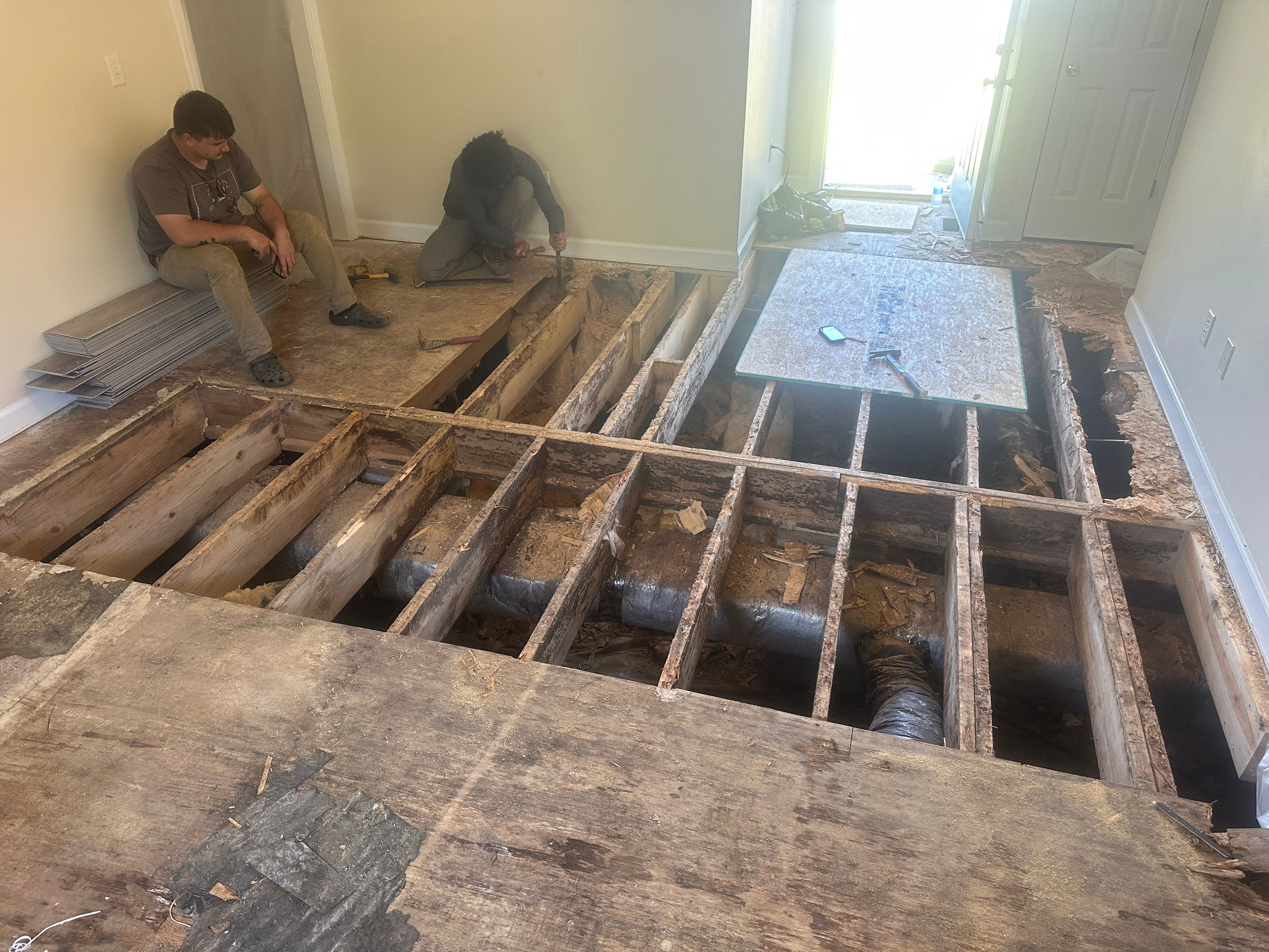 Structural Repairs inludiing sub-floor removal, new floor joists installed, girder replacmeent and dropped girder installed. by Impact Crawlspace
