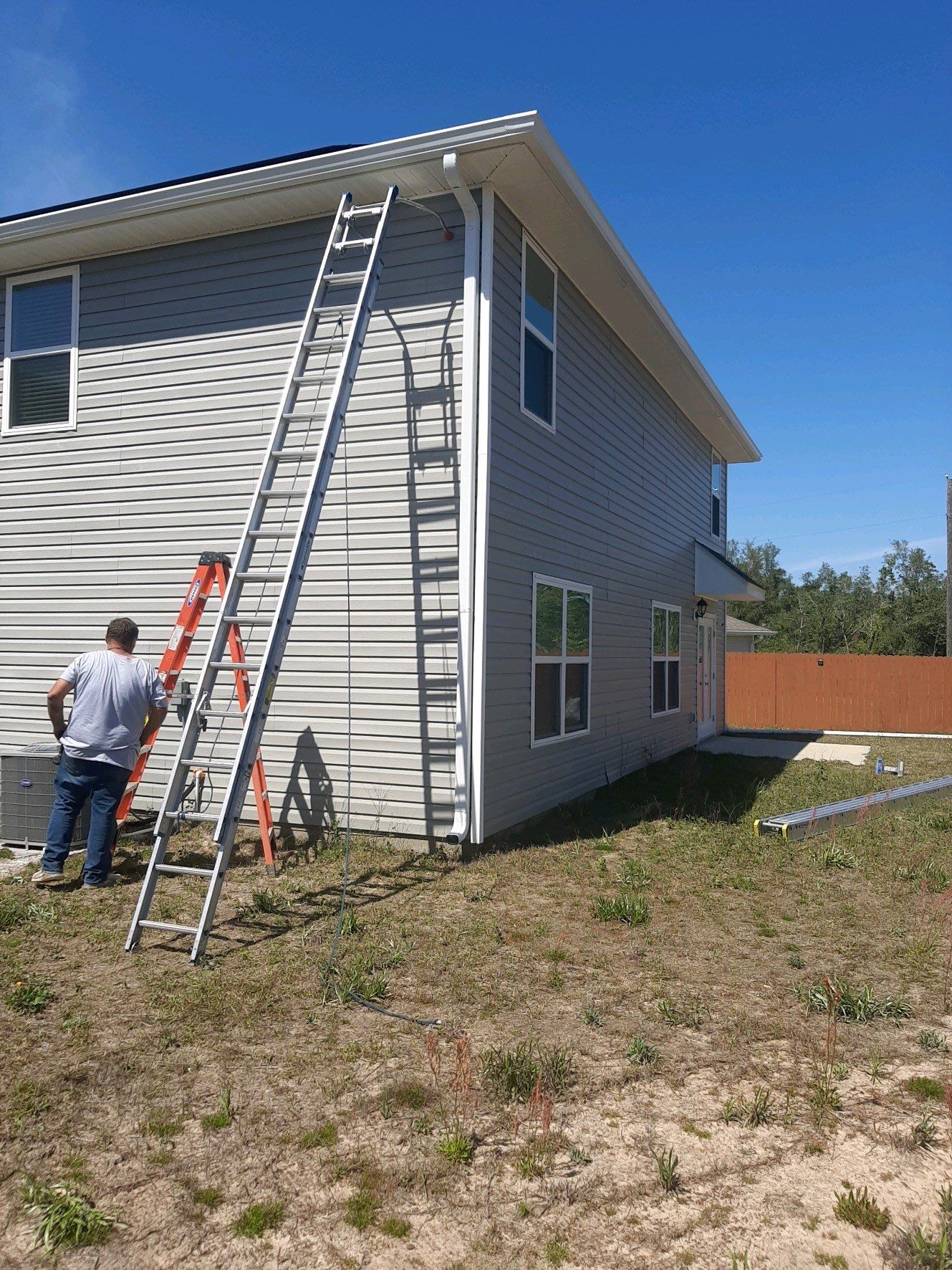 Gutter Installation Using White K-Style Seamless Gutters by Gutter Professors