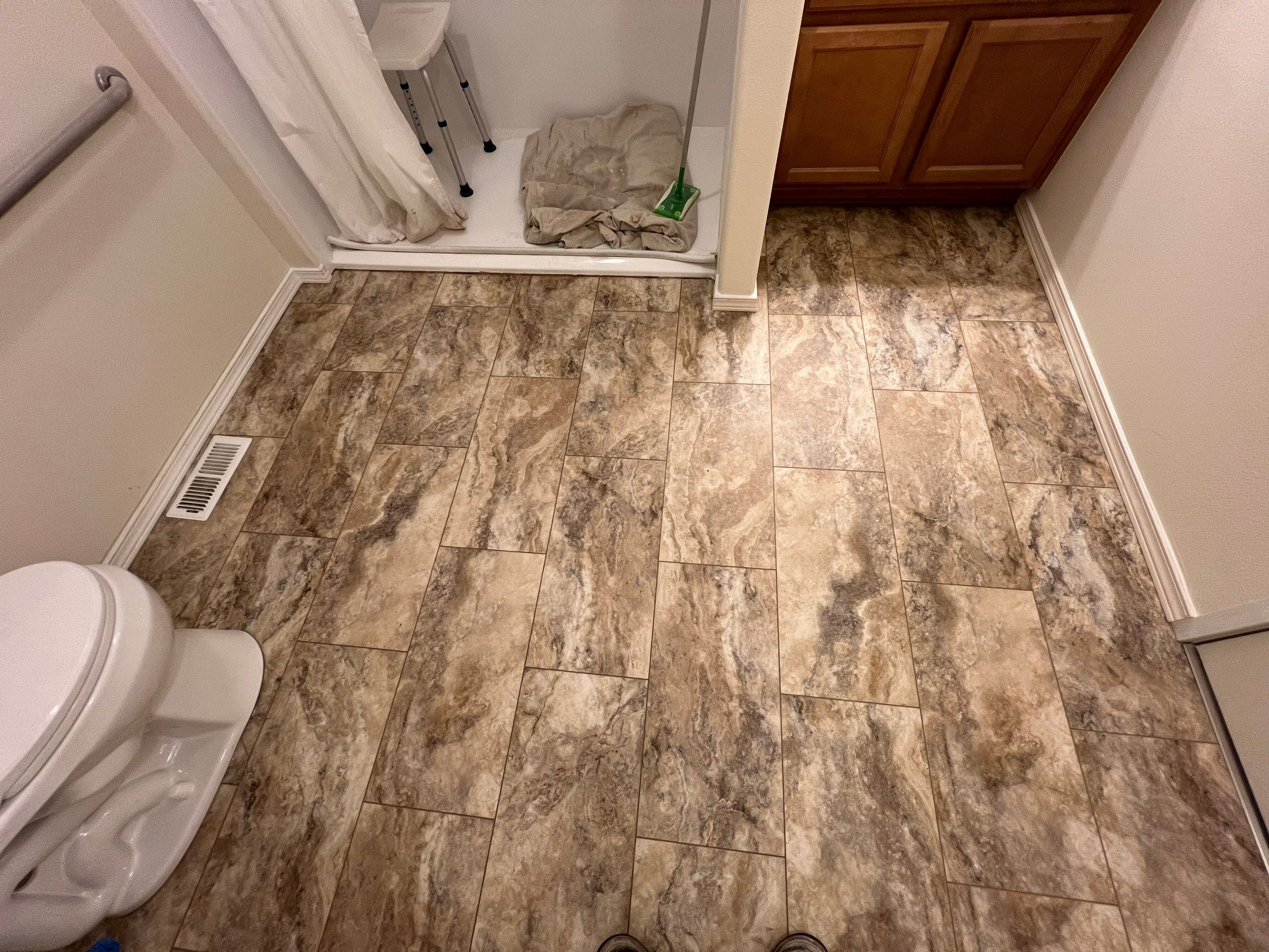 Bathroom flooring upgrade by Handyman State LLC