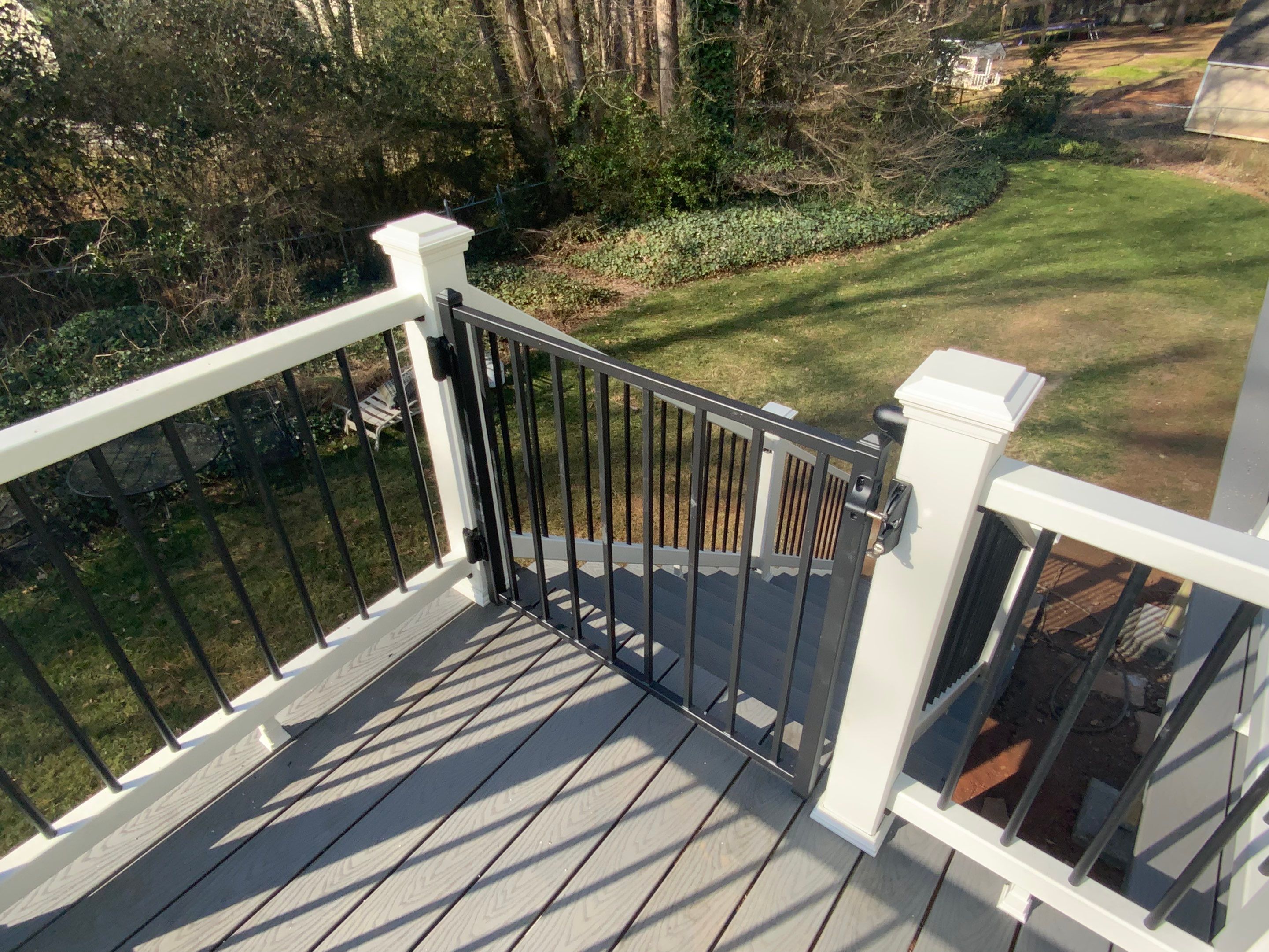 Elevated Grey Composite Deck Installation in Woodstock, Georgia by Swift Home Renovations