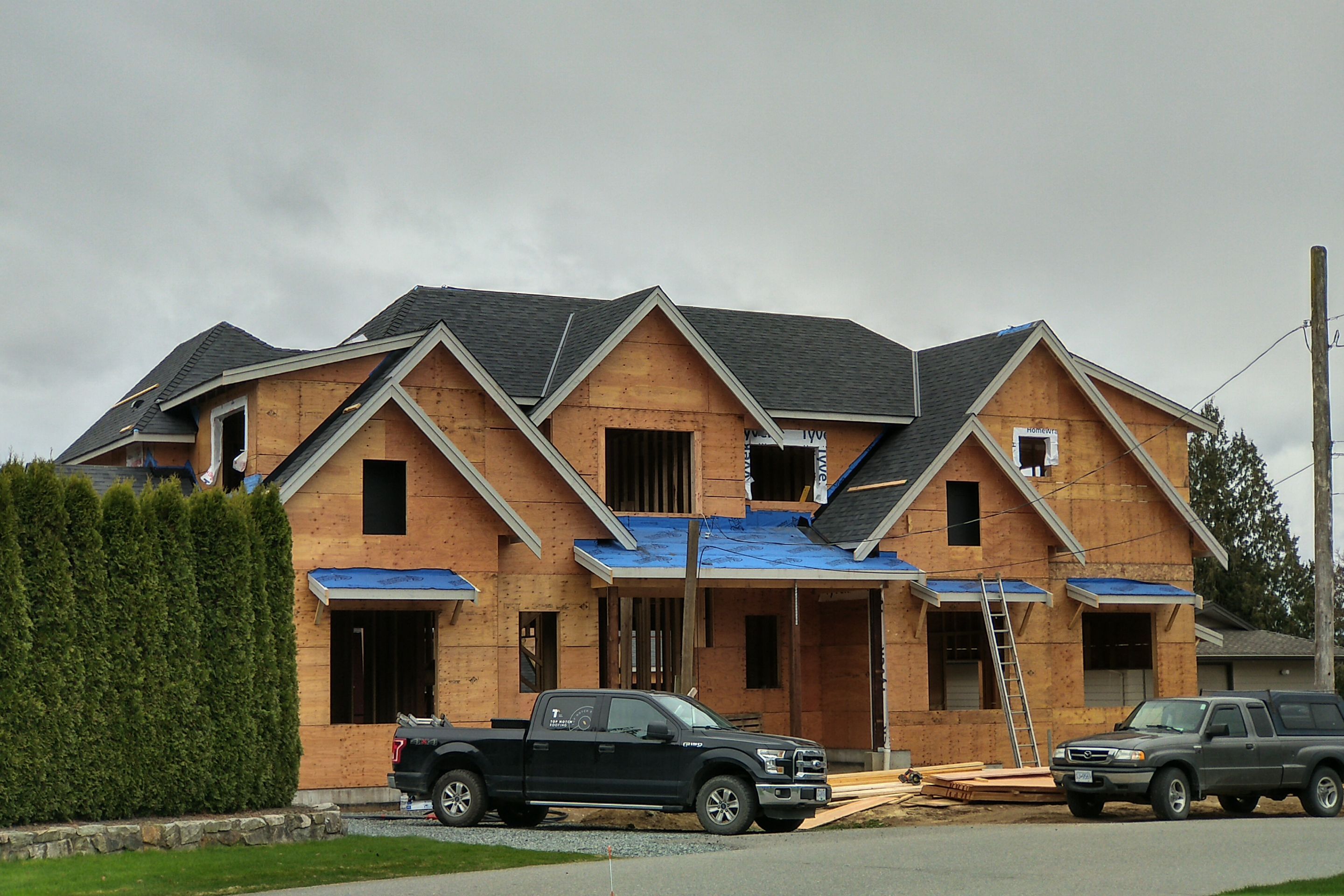 Residential Roofing Installation using Malarky Vista Midnight black by Top Notch Roofing Inc