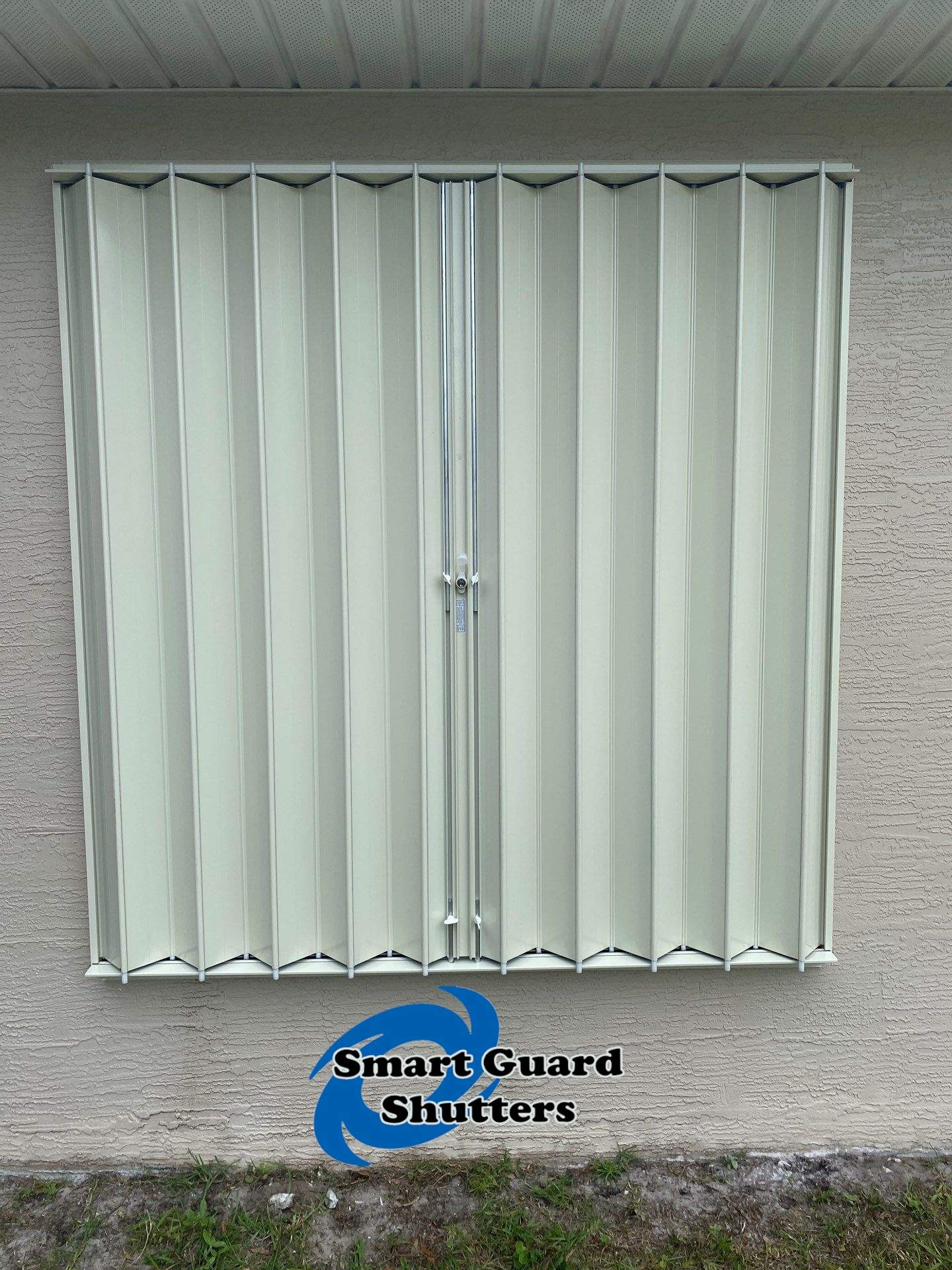Accordion Shutters in Ivory  by Smart Guard Shutters