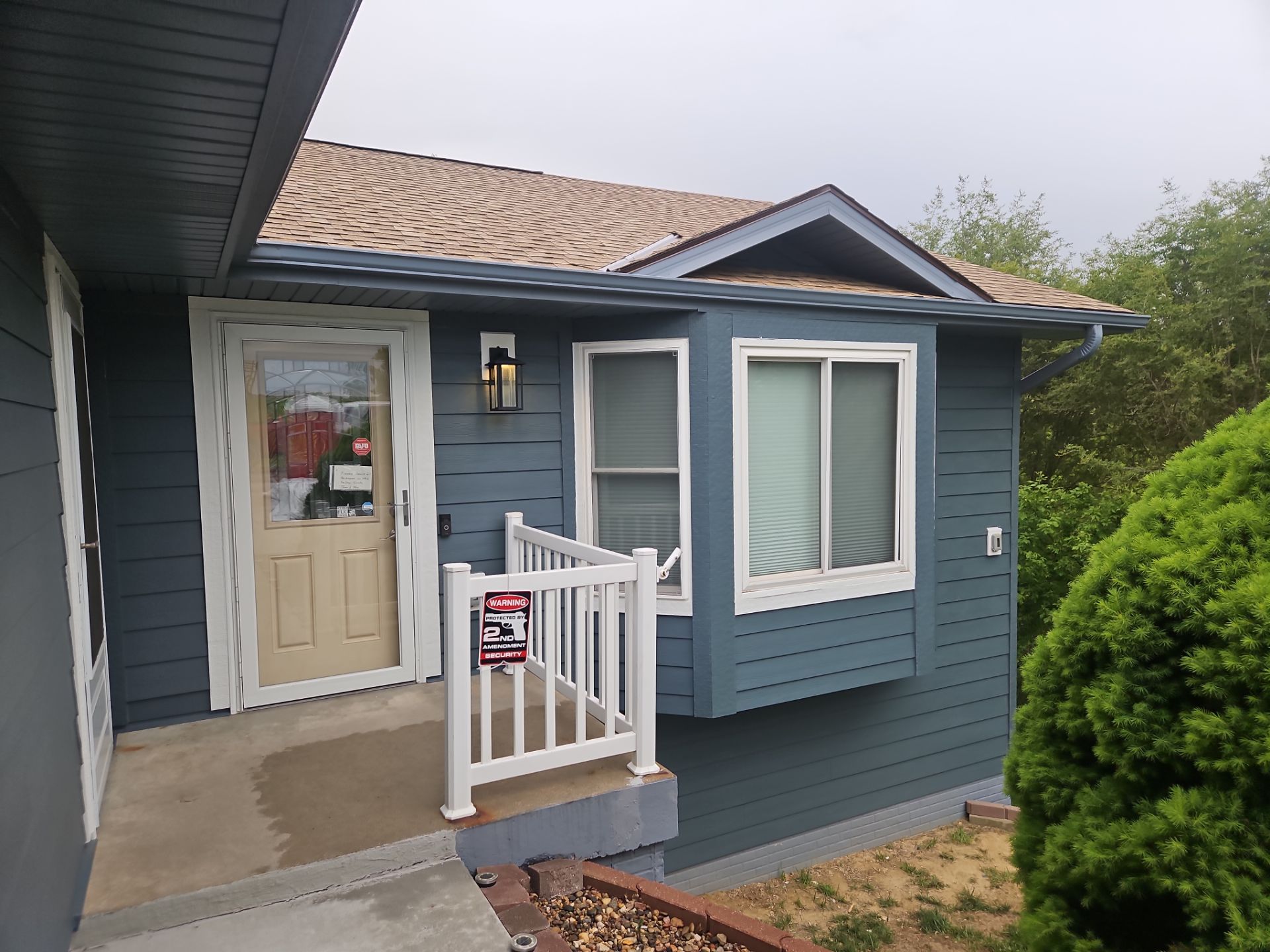 Evening Blue Siding and Window Replacement in Glenwood, Iowa by Carps Complete Exteriors 