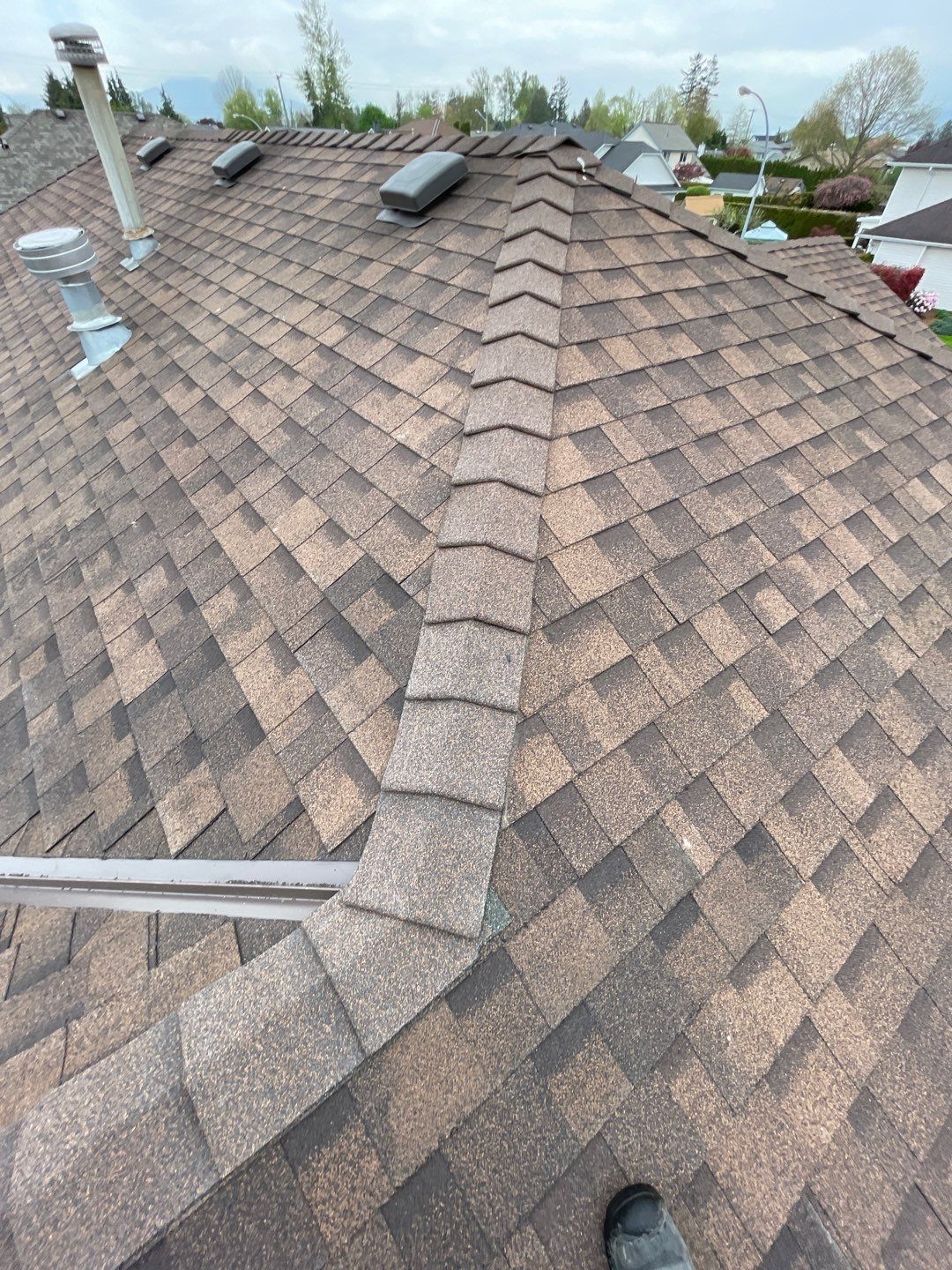 Residential patio roof extension with IKO Dual Brown shingles by Top Notch Roofing Inc