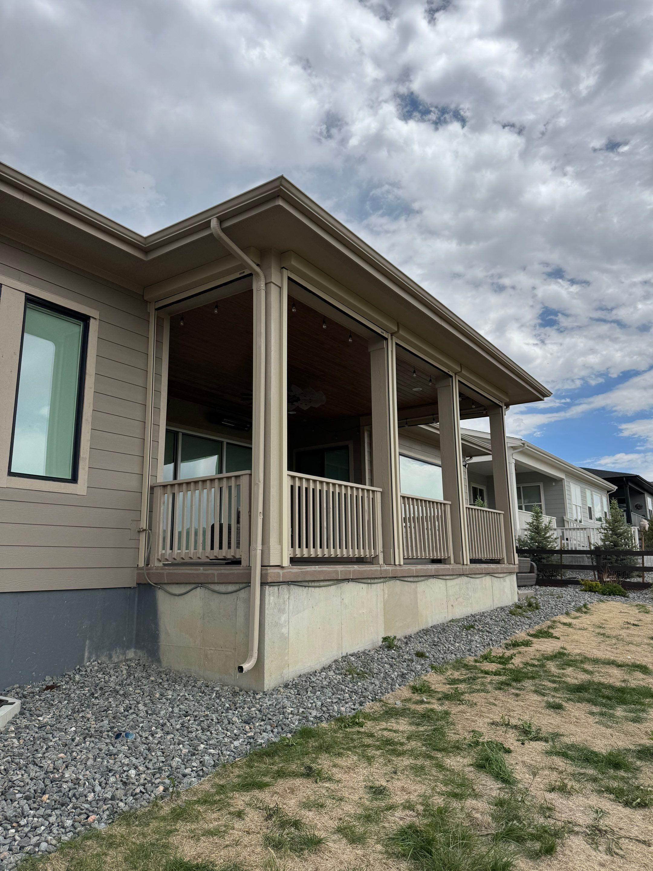 Exterior MagnaTrack Solar Screen Installation on Castle Rock Covered Patio by Outdoor Solutions Colorado