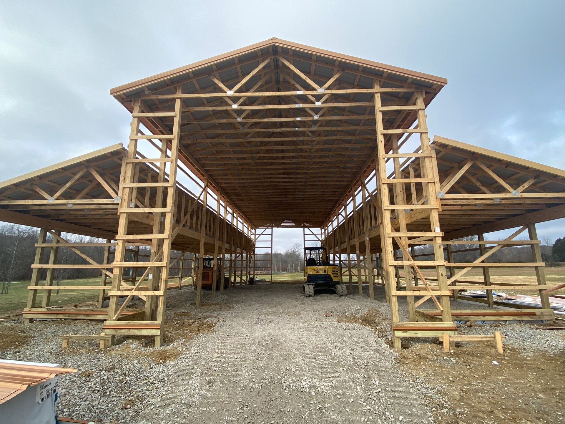 Custom Pole Barn Home with Charcoal Siding and Copper Roof by The Barn Builders
