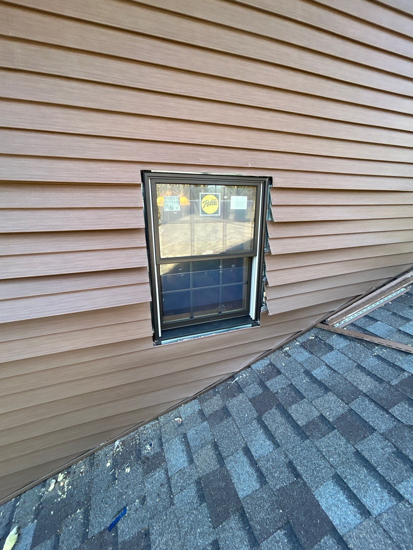 Pella Window installation using Pella Lifestyle wood/Aluminum window by United Windows and Siding LLC