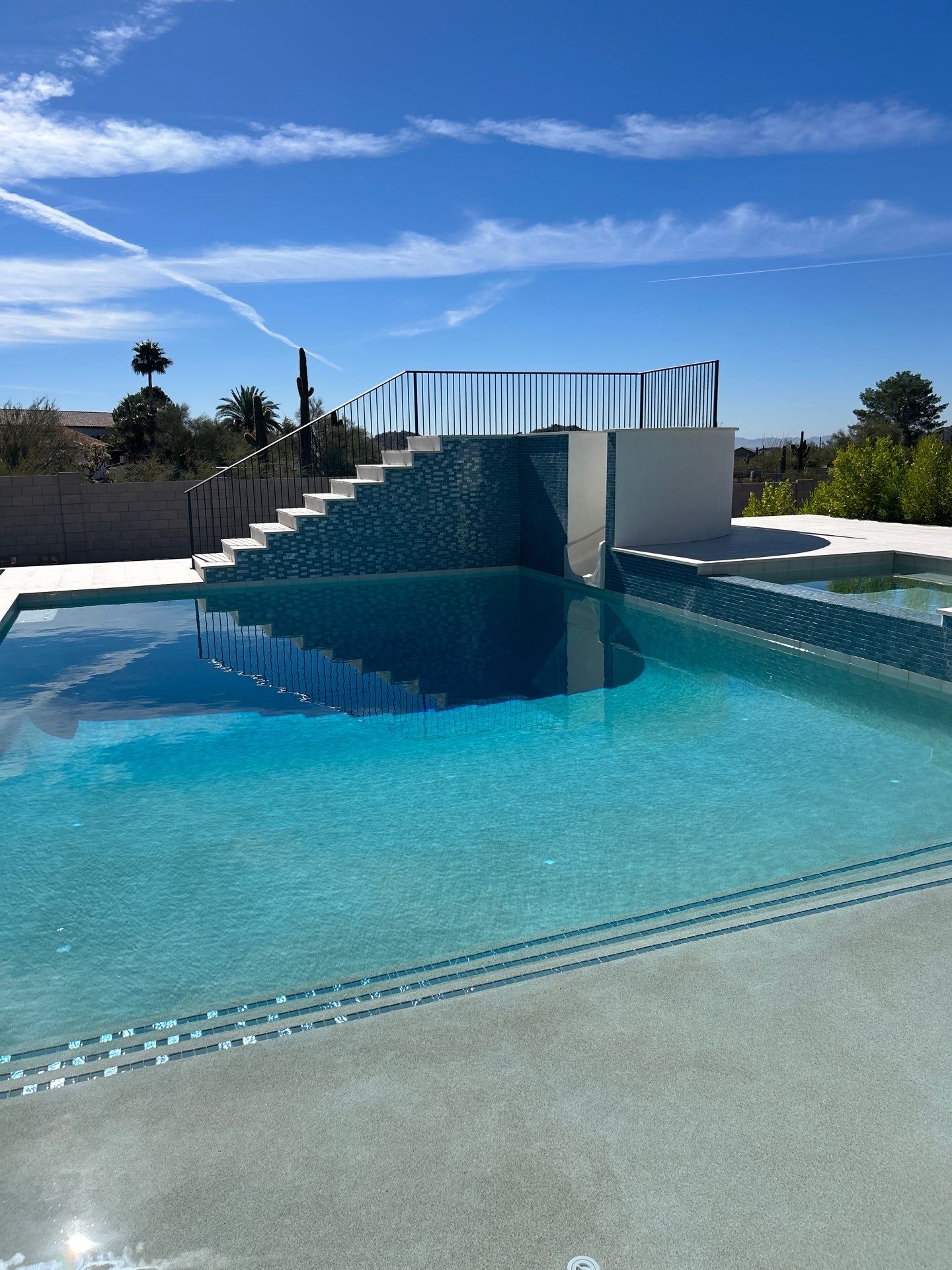 Pool and spa build with slide & outdoor kitchen by Modern Pools