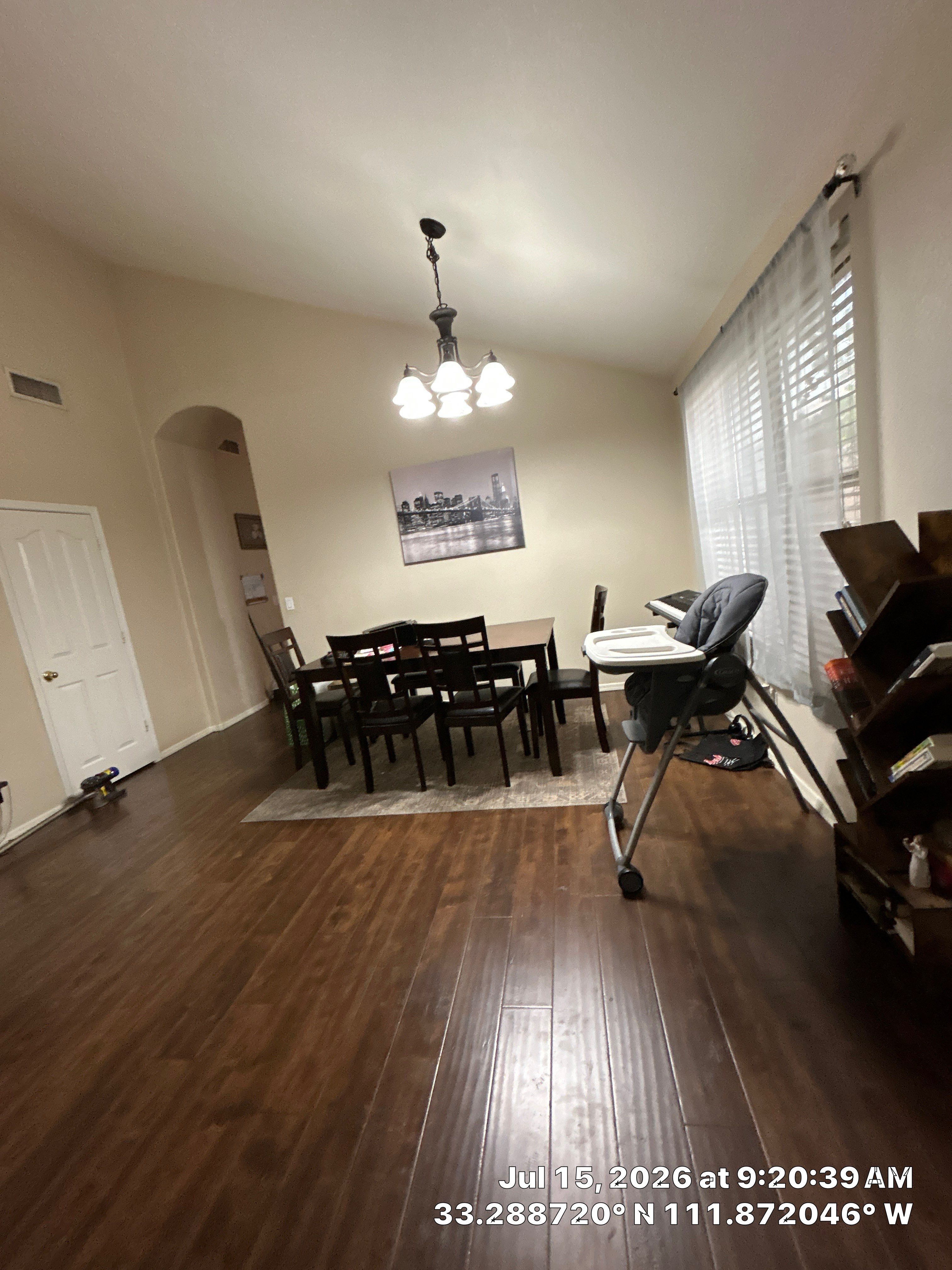 Dark Wood Laminate Flooring Installation for Chandler Dining Room by CompanyCam Sales Demo