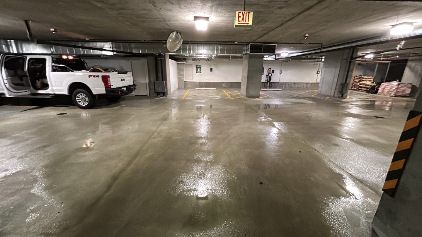 Parking garage using Hot water by Northern Power Washing LLC.