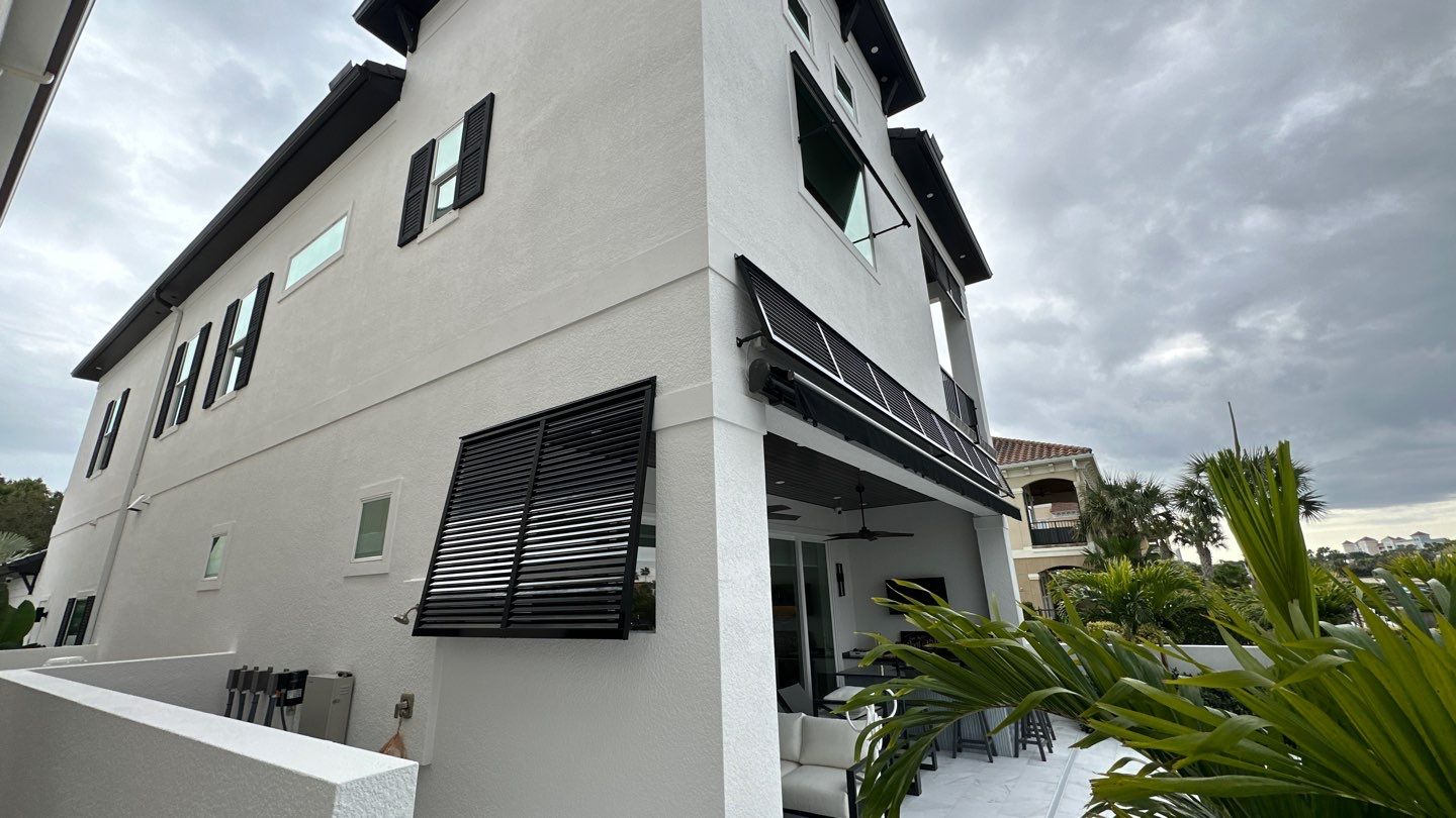 Bahama Shutters in Jet Black by Smart Guard Shutters