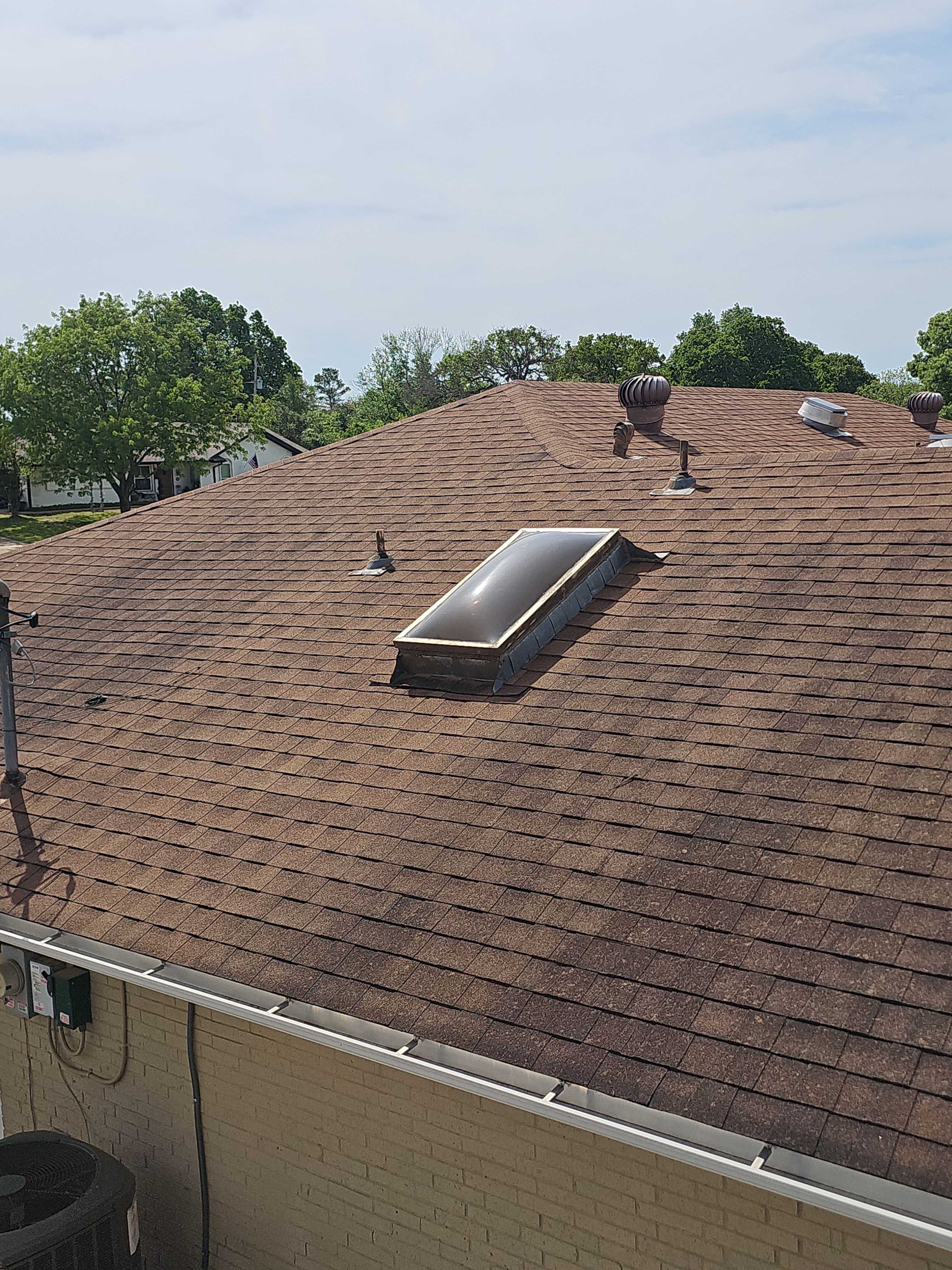 "Full Roof Replacement Due to Hail and Water Damage – Before & After" by road roofing llc