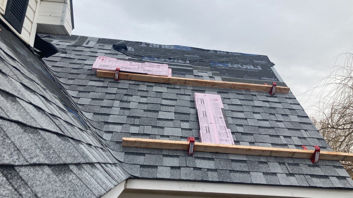 Two story farmhouse style roofing installation using Owens Corning Duration in the color Teak by ID Roofing LLC
