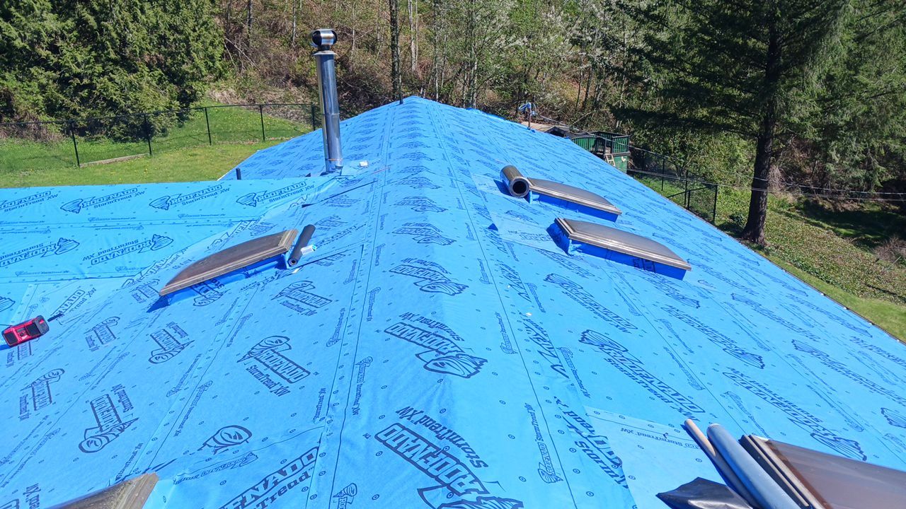 Residential ReRoofing Installation using 12" Prolok metal by Top Notch Roofing Inc