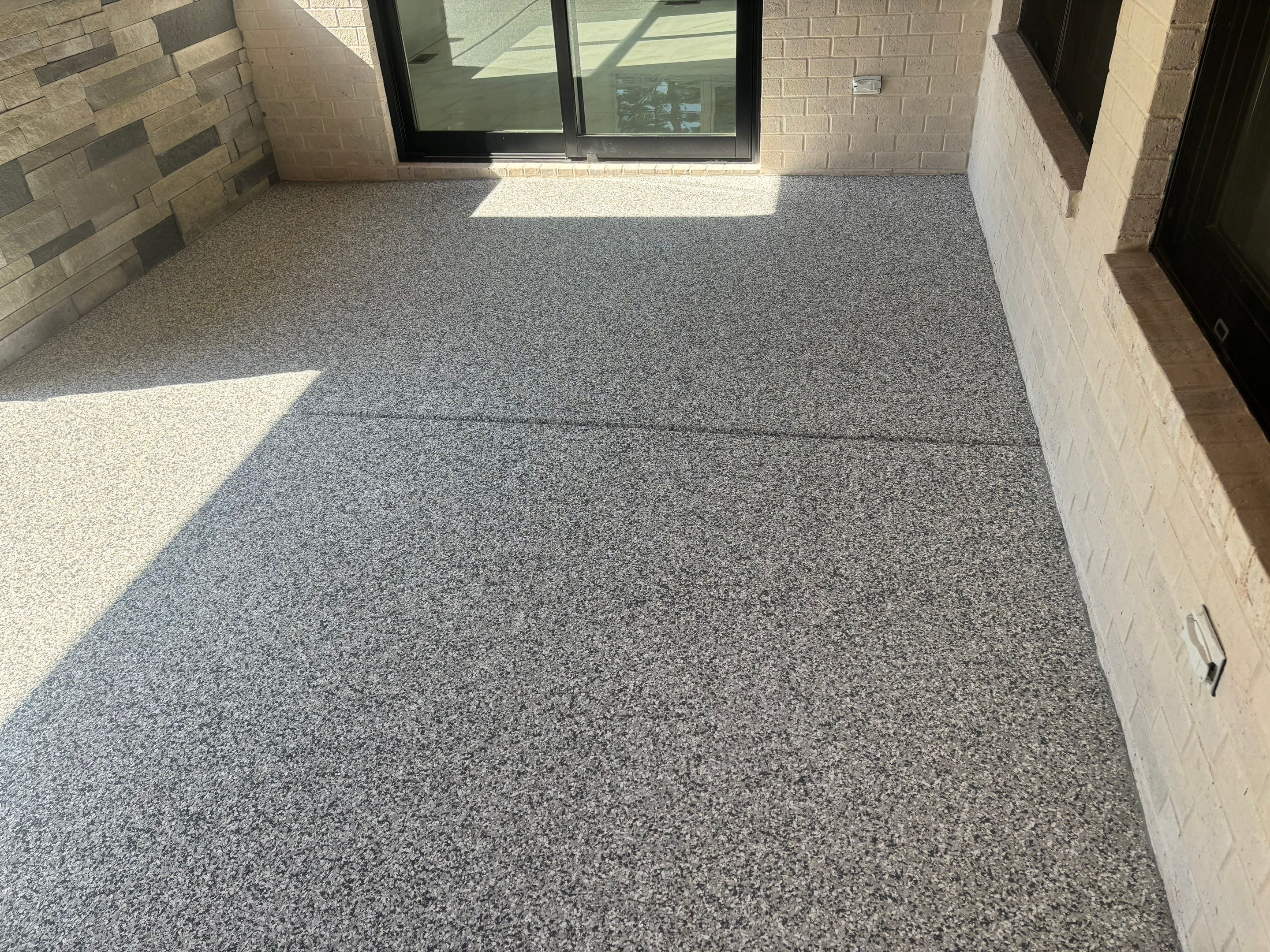 Porch & Garage Using Tidal Wave & Gravel  by Elite Floor Solutions