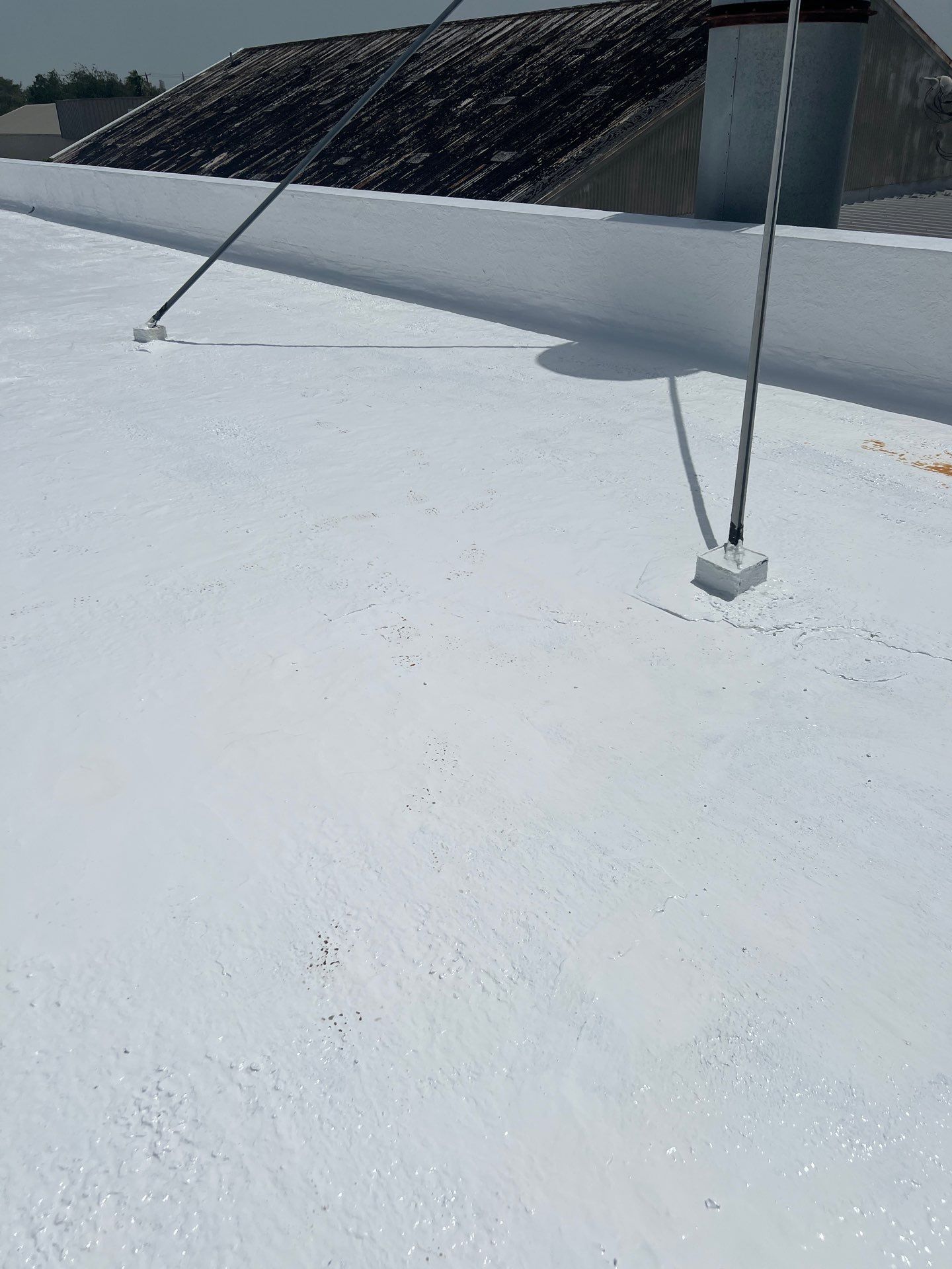 Dirty leaking Gravel Roof by Bayfront Roofing and Construction
