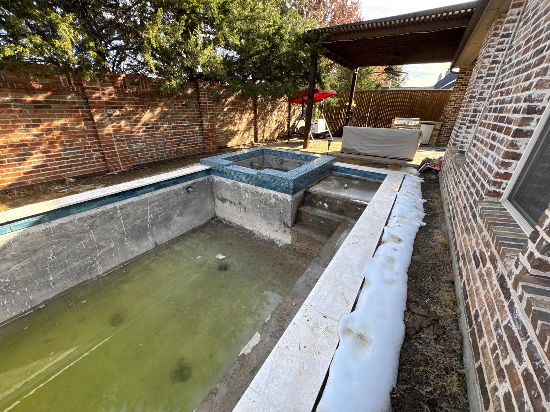 Geometric Pool with Raised Stone Spa by Pinnacle Pools and Spas - DFW