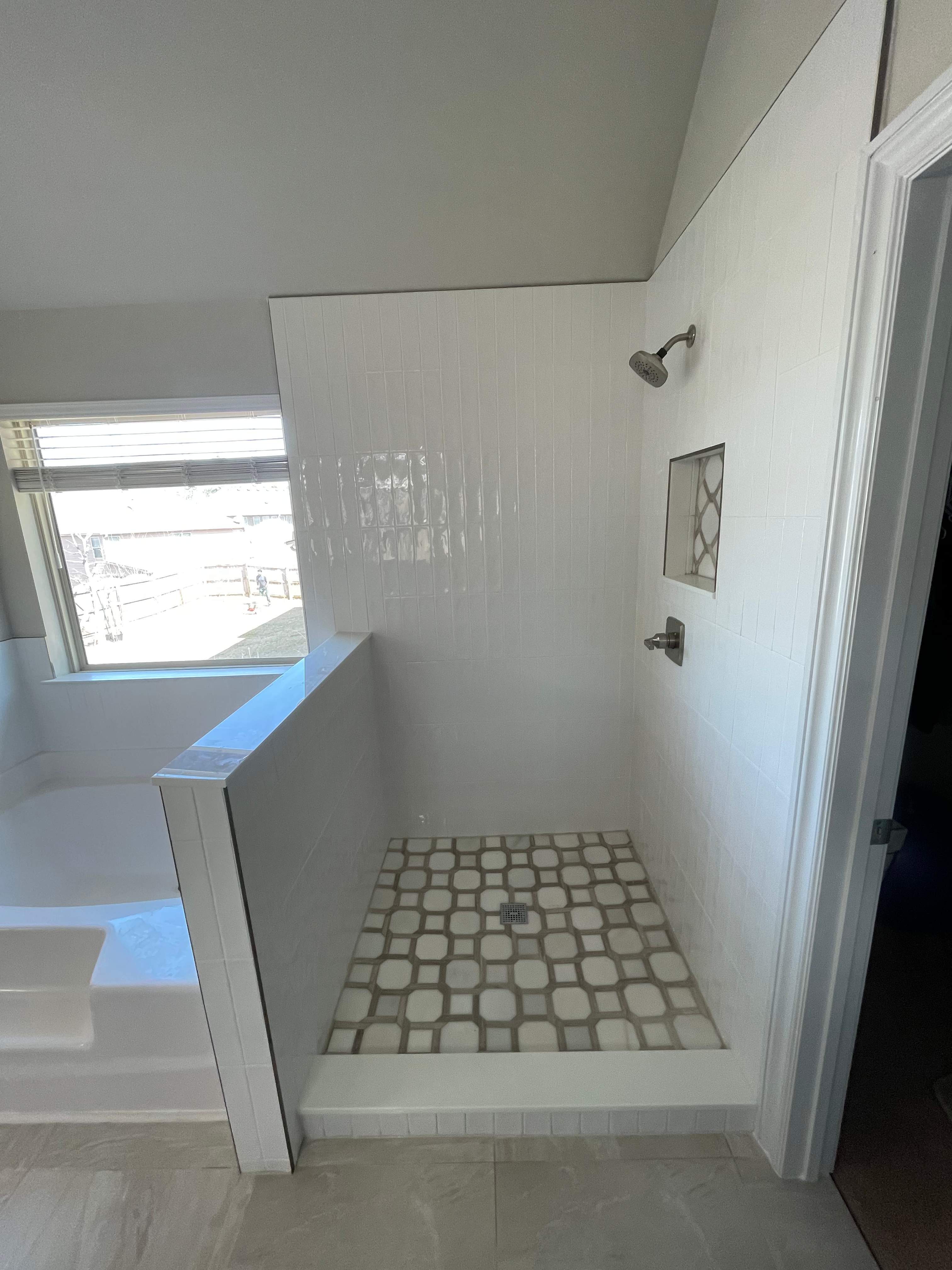 Shower retile and bathroom flooring by Prudencio