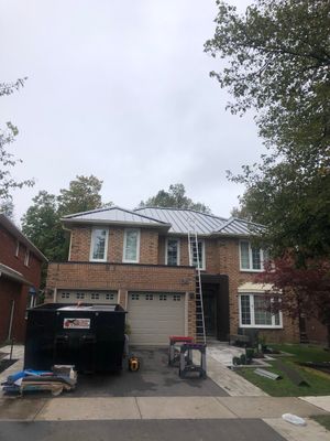 Residential Roofing Installation using 16" Standing Seam Panels