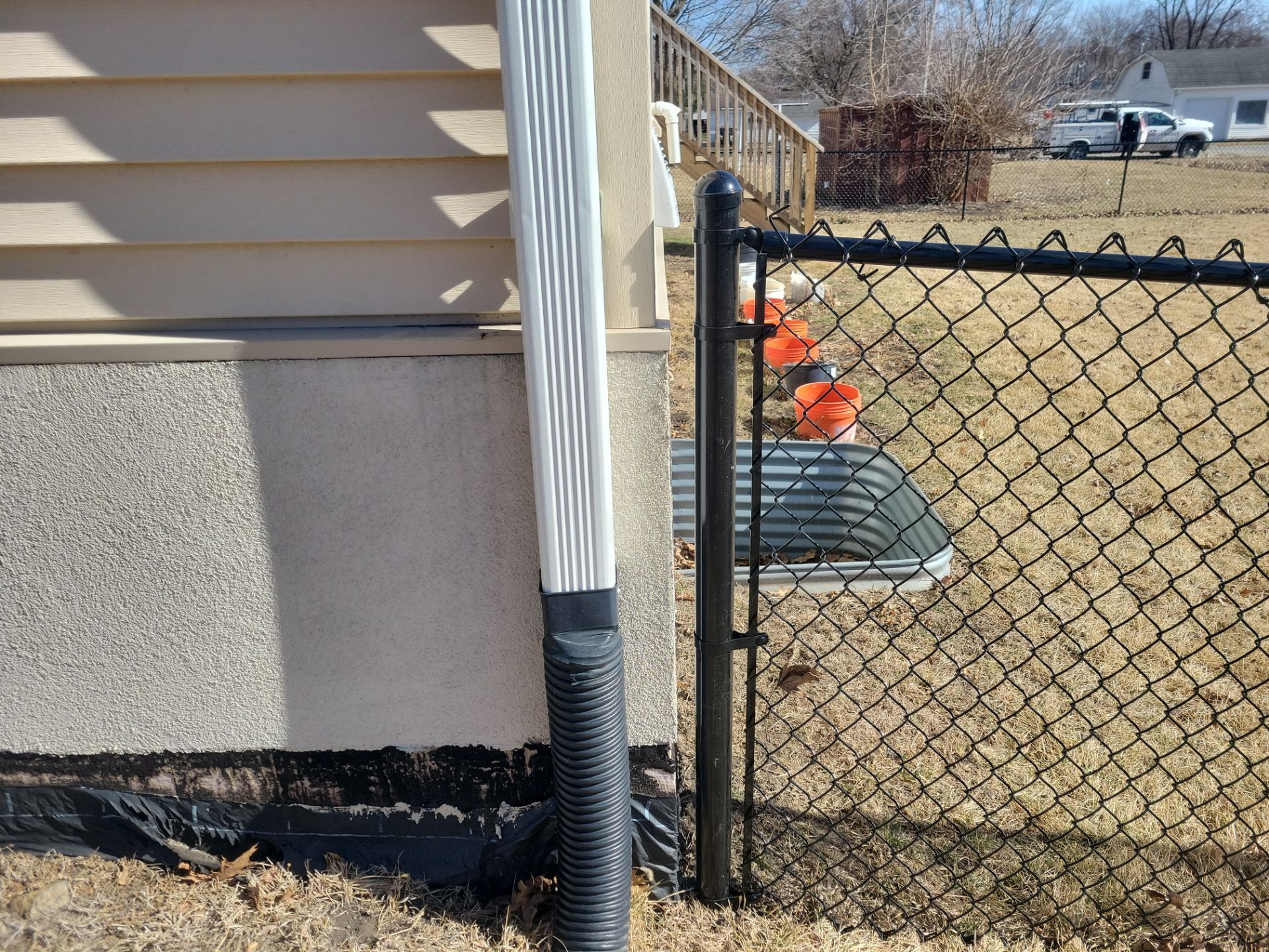Residential Black Chain Link Fence and Gate Installation in Tripoli by Perfect Picket Fence and Stain