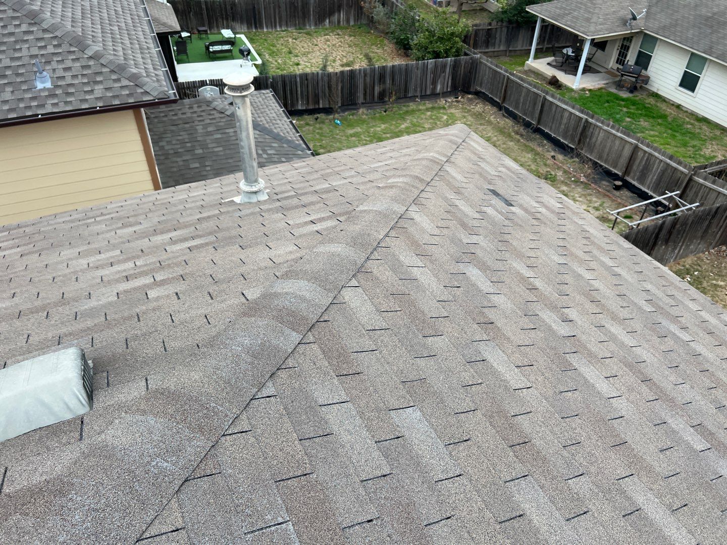 Wind damaged roof replacement by Oakwood Roofing and Construction, LLC