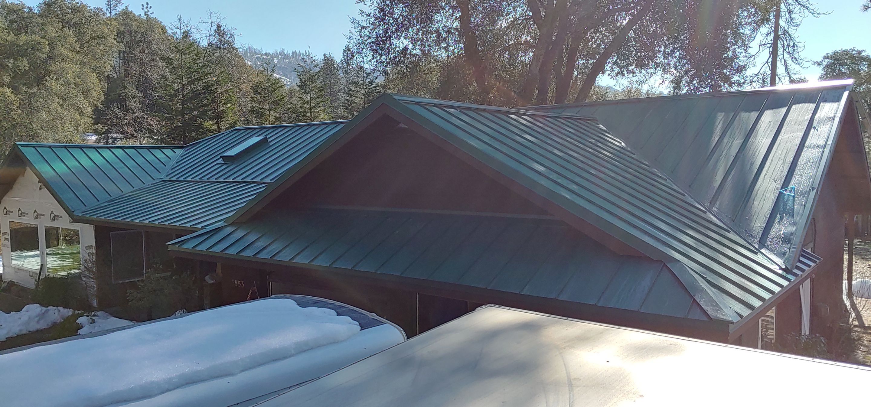 Metal roofing installation using Standing seam metal roofing system by Straight Edge Roofing Inc
