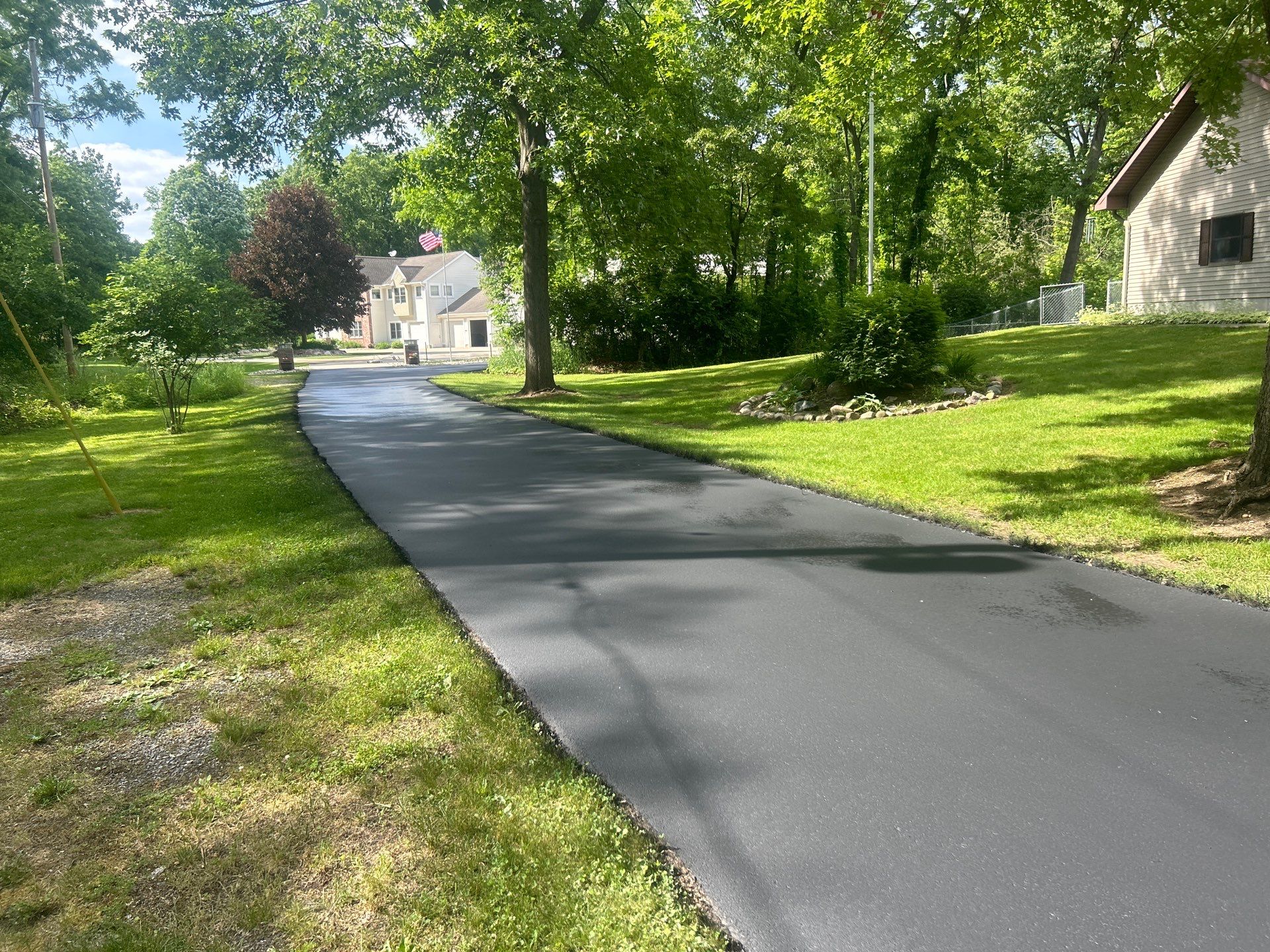 High end residential driveway by Quality Asphalt & Maintenance LLC