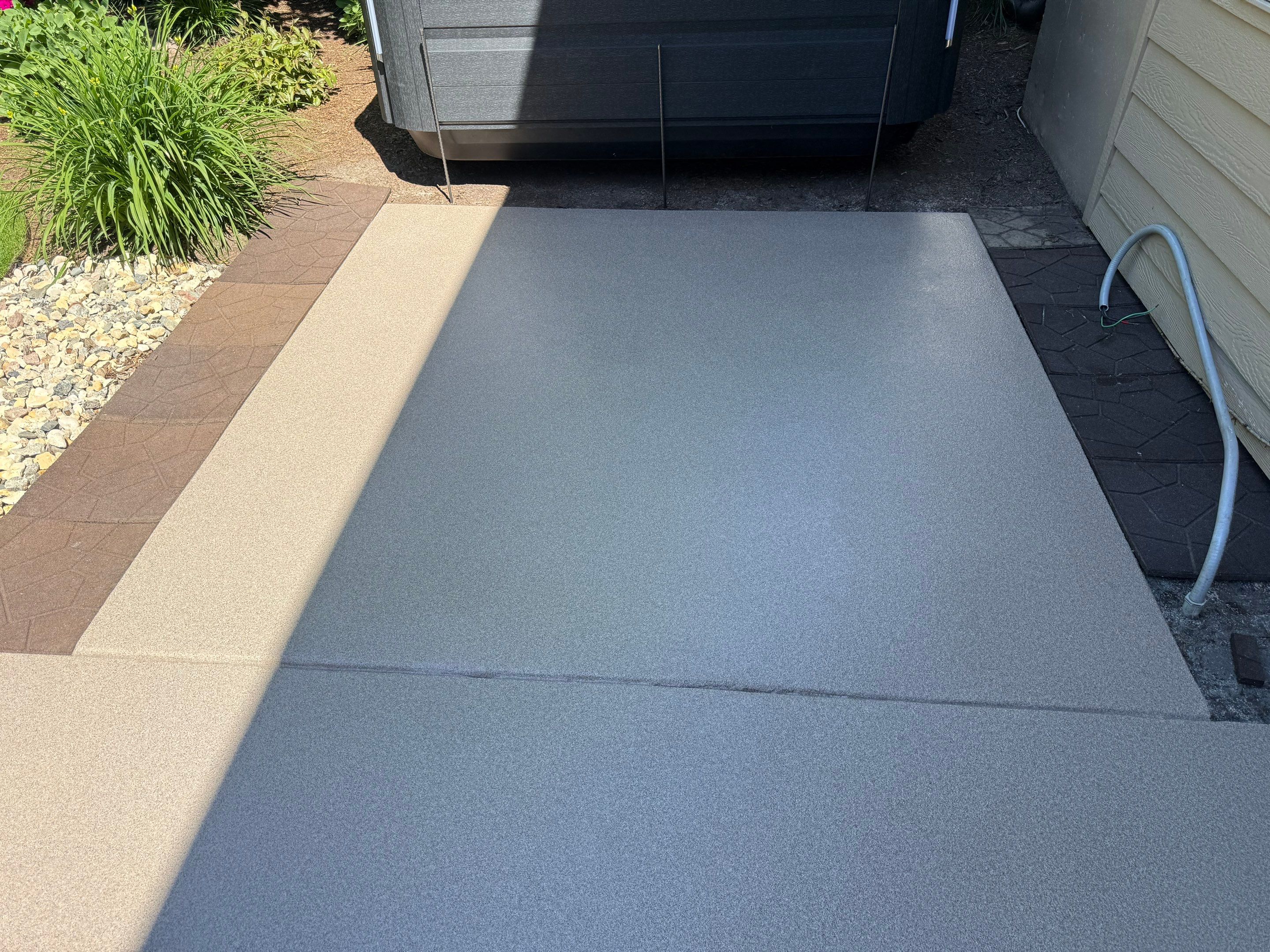 Textured Concrete Coating and Paver Patio Refresh in Sioux Falls by Select Painting, Coatings & Garage Cabinets