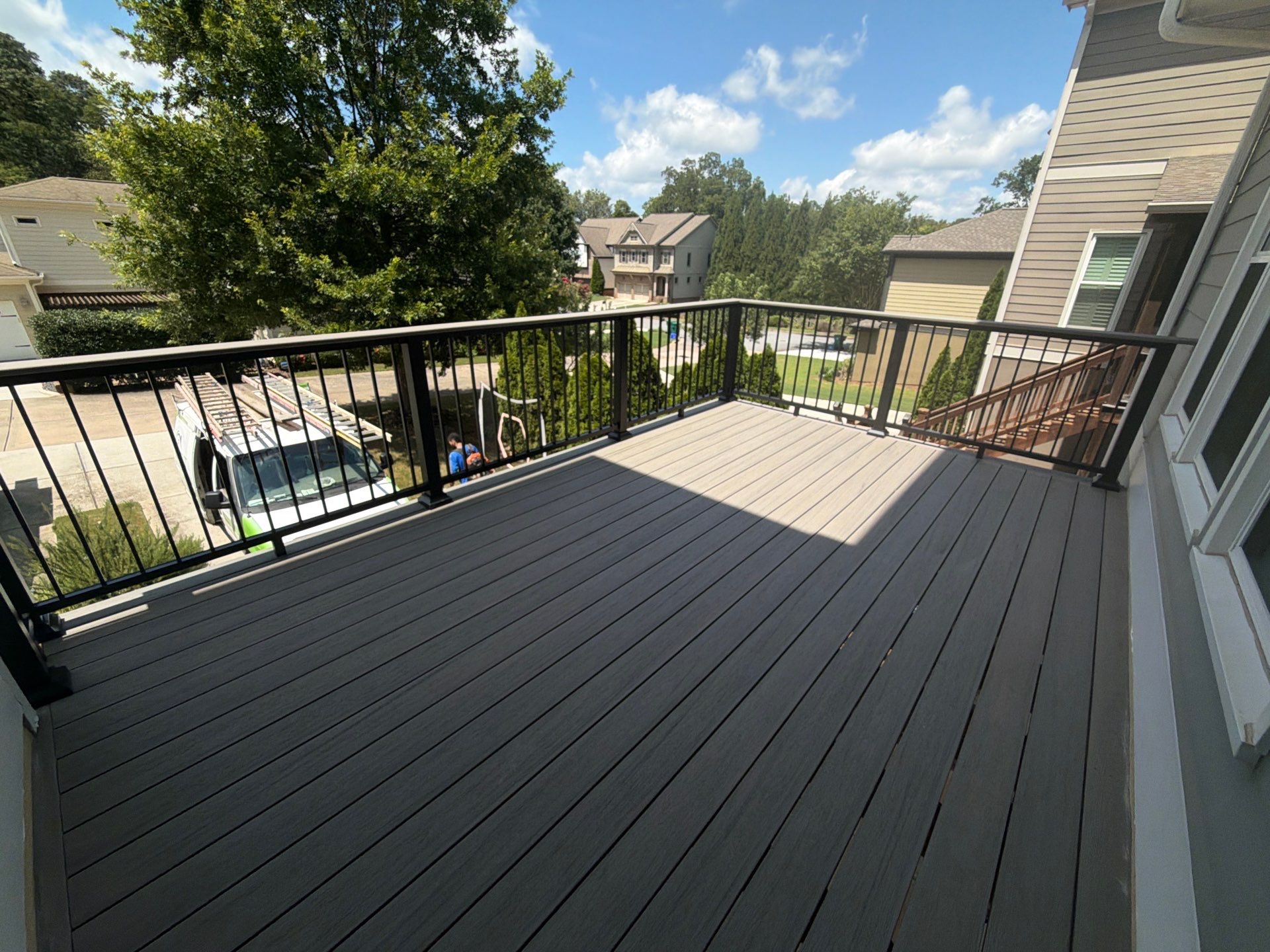 Elevated Composite Deck Replacement with Metal Railings in Smyrna by Swift Home Renovations 