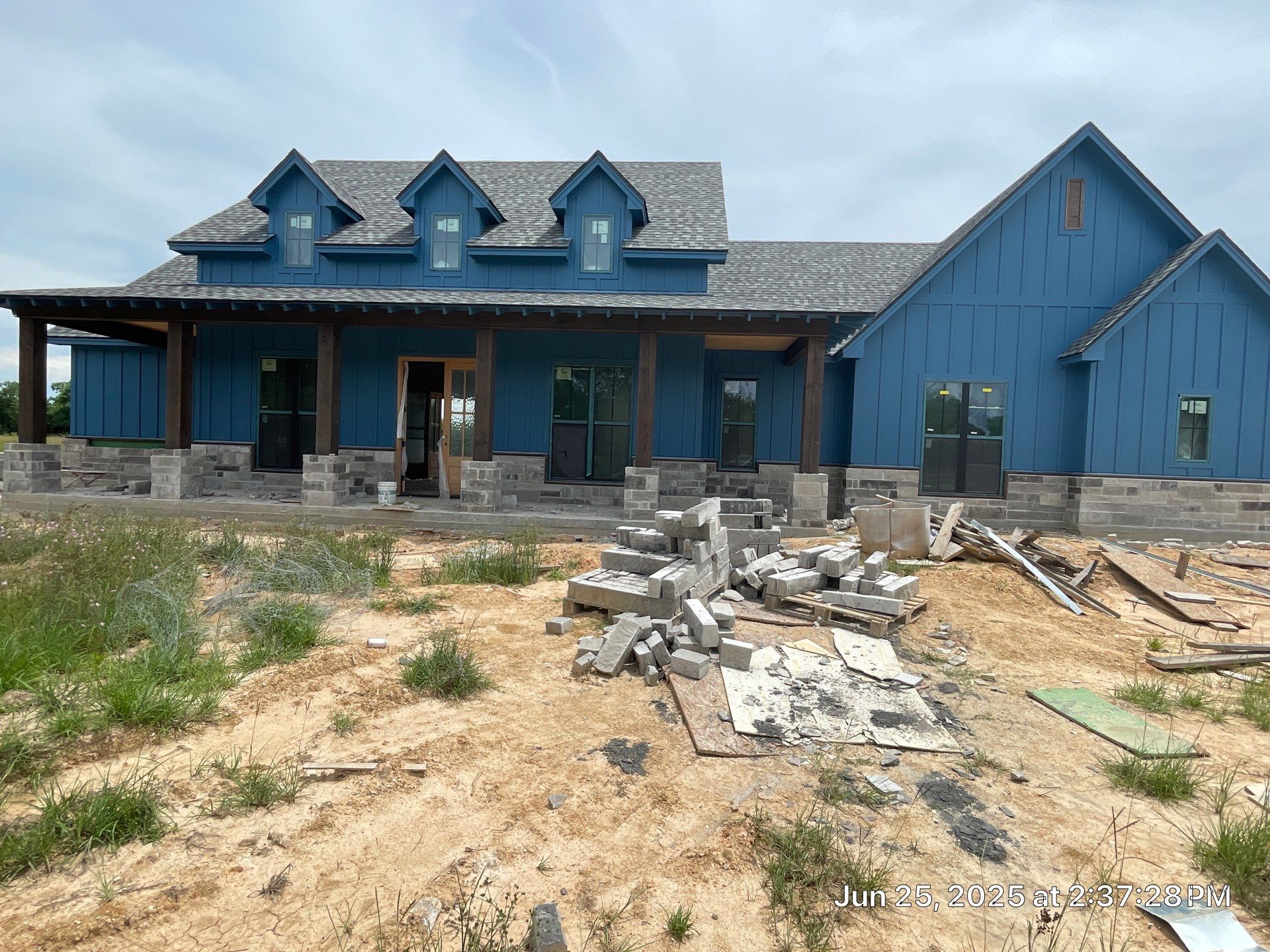 Natural Stone Elegance: Apex Installation Accented by Blue Siding by Apex Conventional Stucco Llc