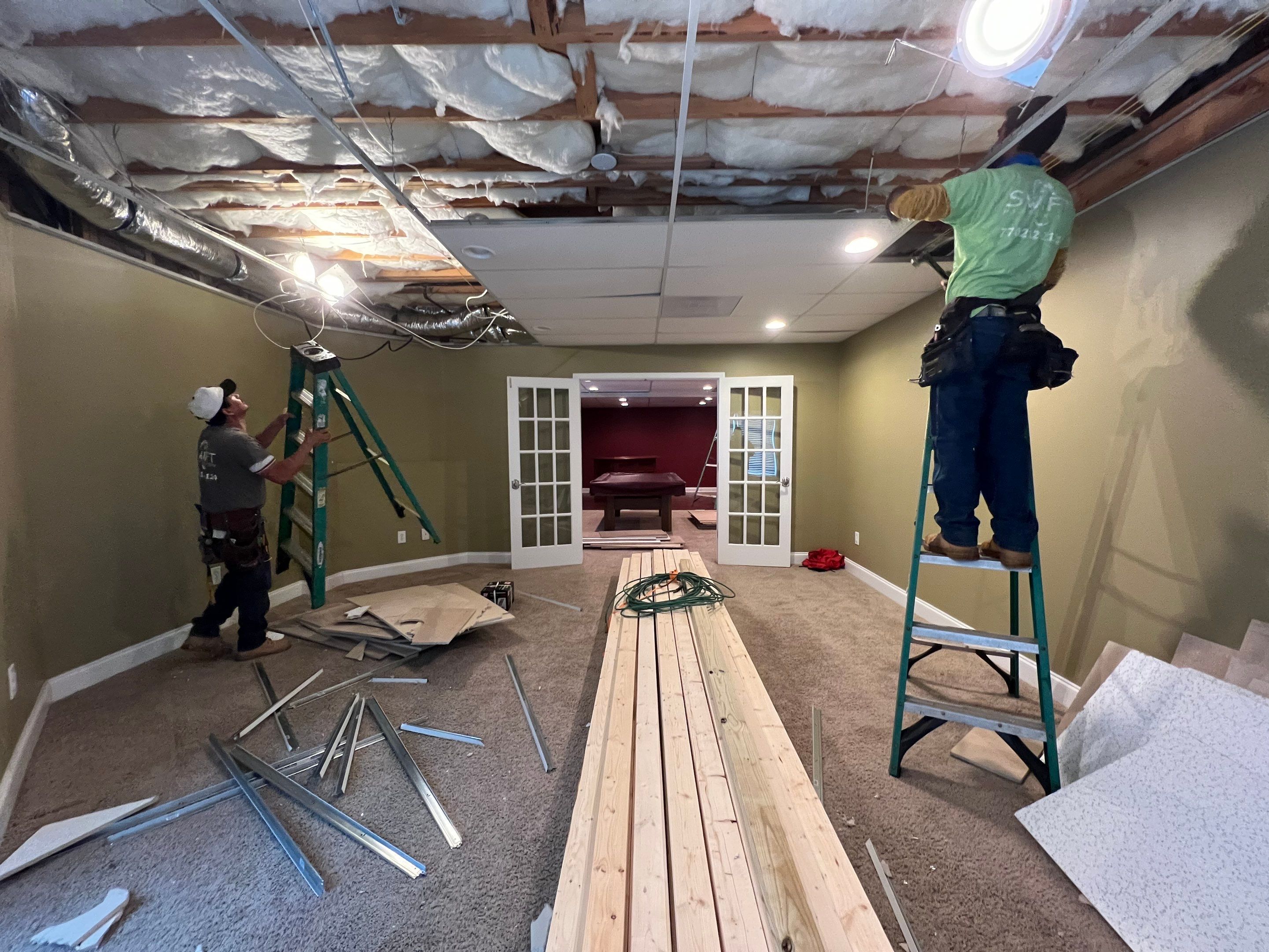 Modern Basement Remodeling in Woodstock with Custom Live-Edge Bar by Swift Home Renovations