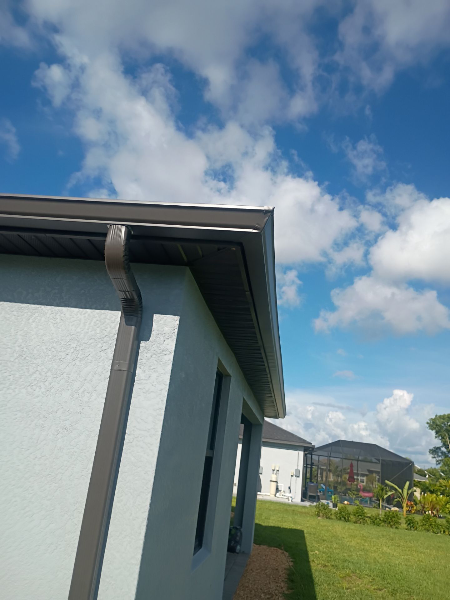 Dark Bronze Seamless Gutters using 6 Inch Seamless Gutters in Cape Coral FL by Gutter Professors