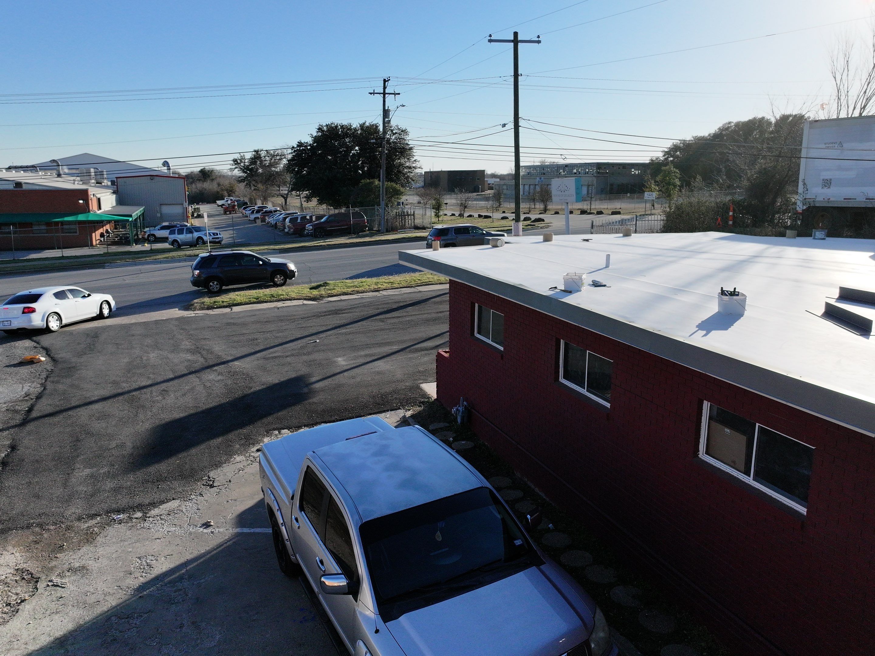 Commercial roofing overlay using GAF TPO over an old ballast roof by Becker Roofing and Exteriors