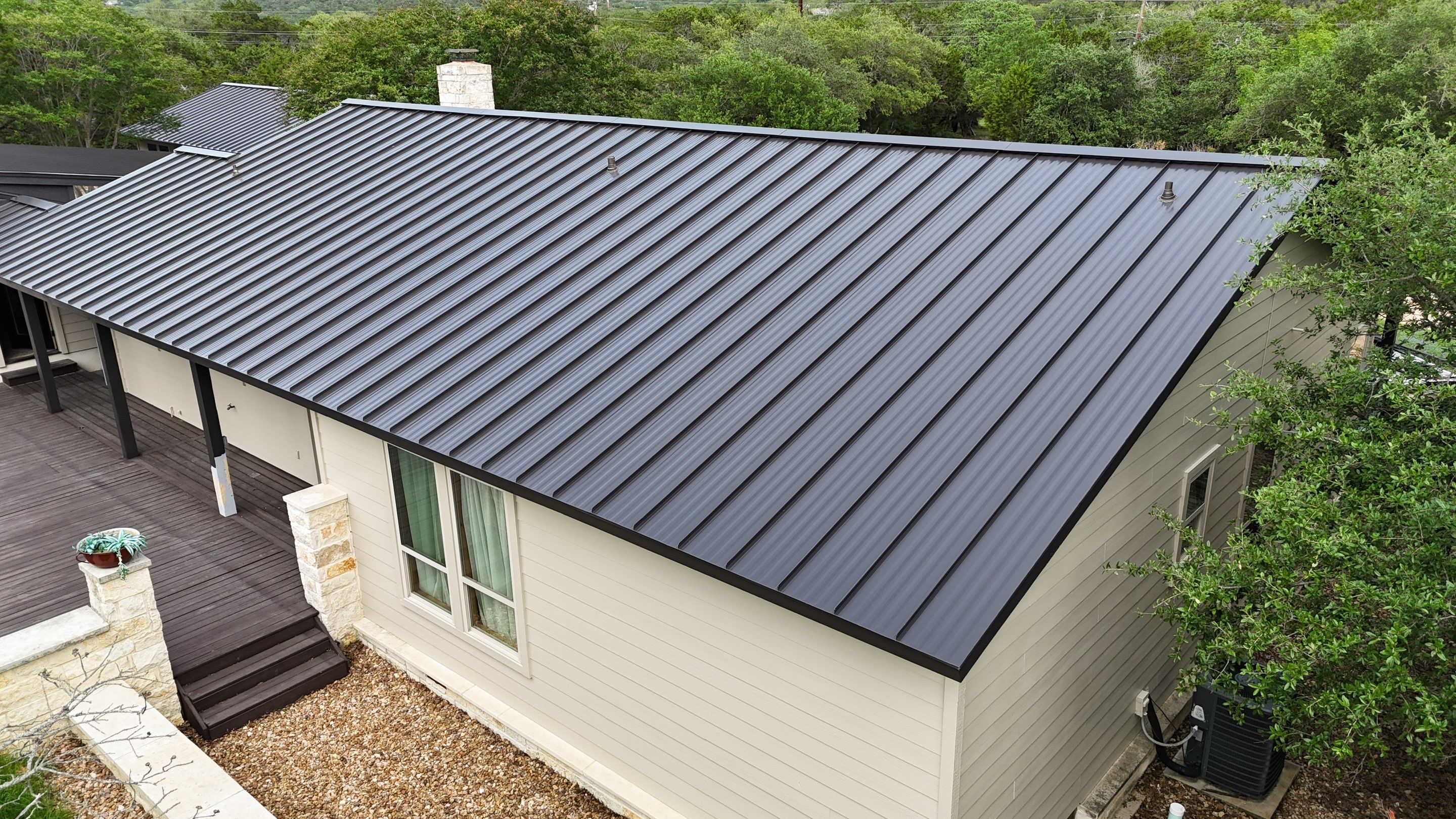 Dark Bronze Fully Striated panel by Wimberley Roofing