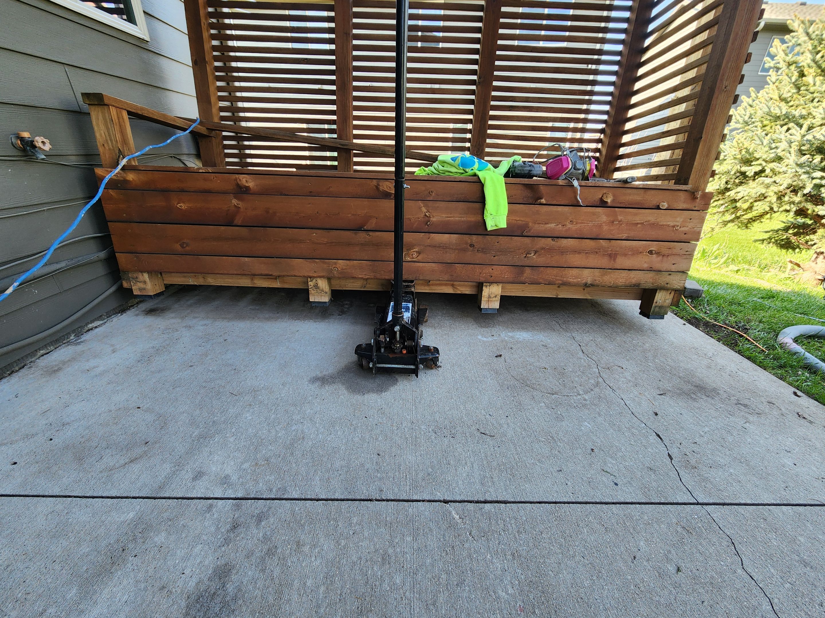 Coyote Flake Concrete Coating for Sioux Falls Patio by Select Painting, Coatings & Garage Cabinets