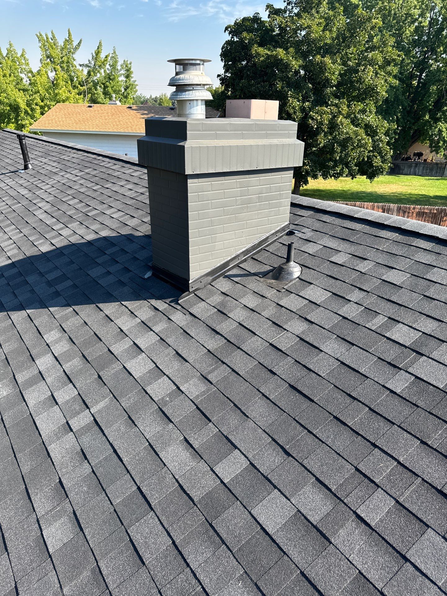 Asphalt Shingle Roof Replacement and Chimney Flashing in Boise by Olive Roofing