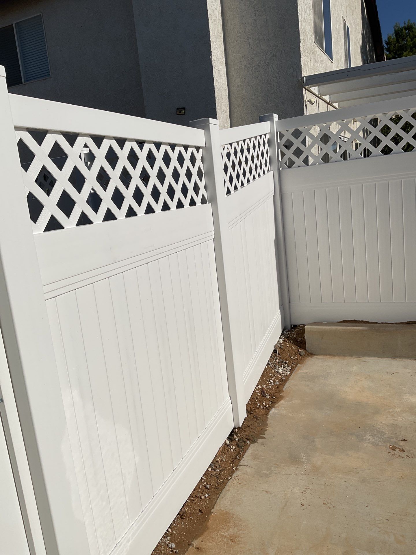 Lattice Vinyl with Privacy Vinyl Fence by Fence Guys Inc.