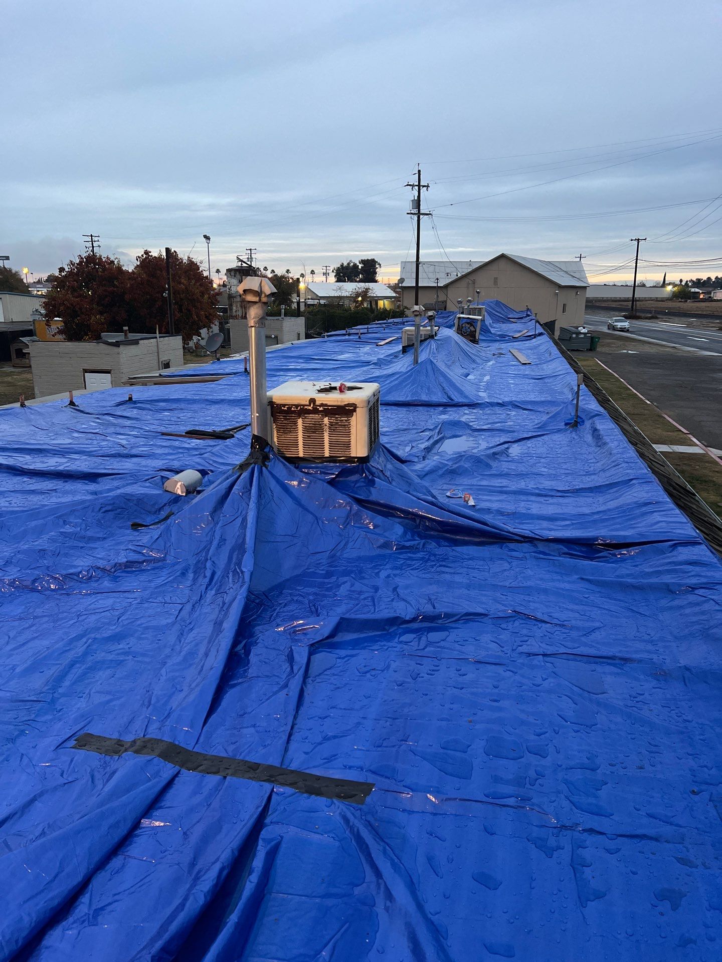 Emergency Roof Tarp Service - Fresno, CA by Grandmark Service Company