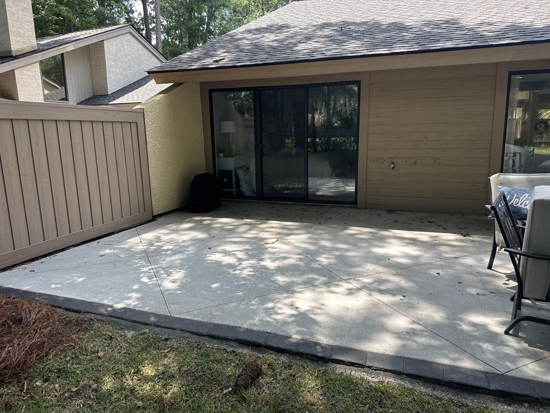 Custom Concrete Patio and Herringbone Paver Walkway in Hilton Head Island by Lowcountry Scapes, LLC