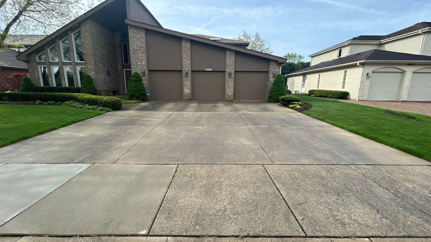 concrete patio and driveway cleaning by Northern Power Washing LLC.